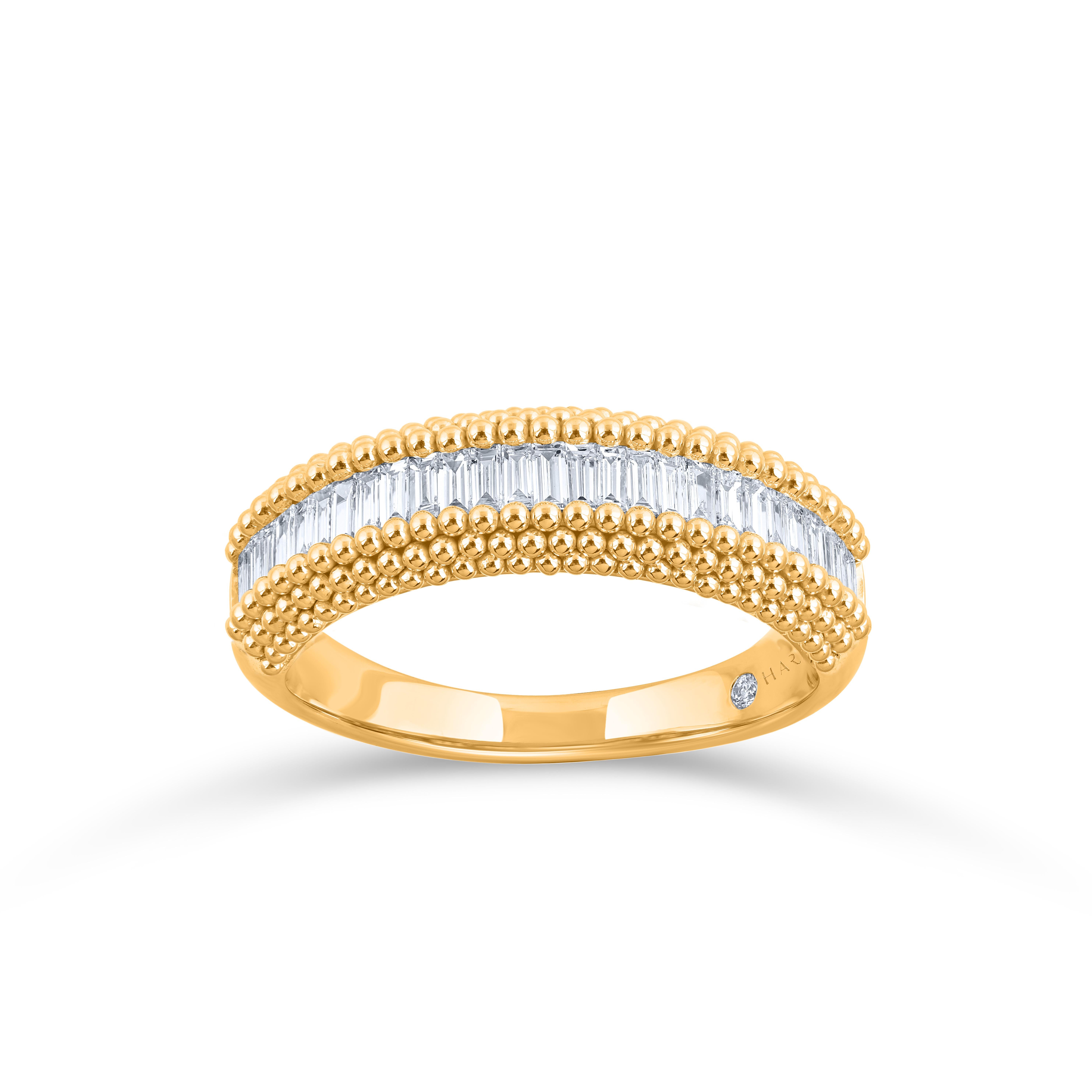 Set with 29 wide baguettes in channel setting vertically in yellow gold granulation border, and 1 brilliant cut diamond in the inner shank, this half eternity men's diamond ring is crafted in 18 KT yellow gold. The beauty of the ring is enhanced by