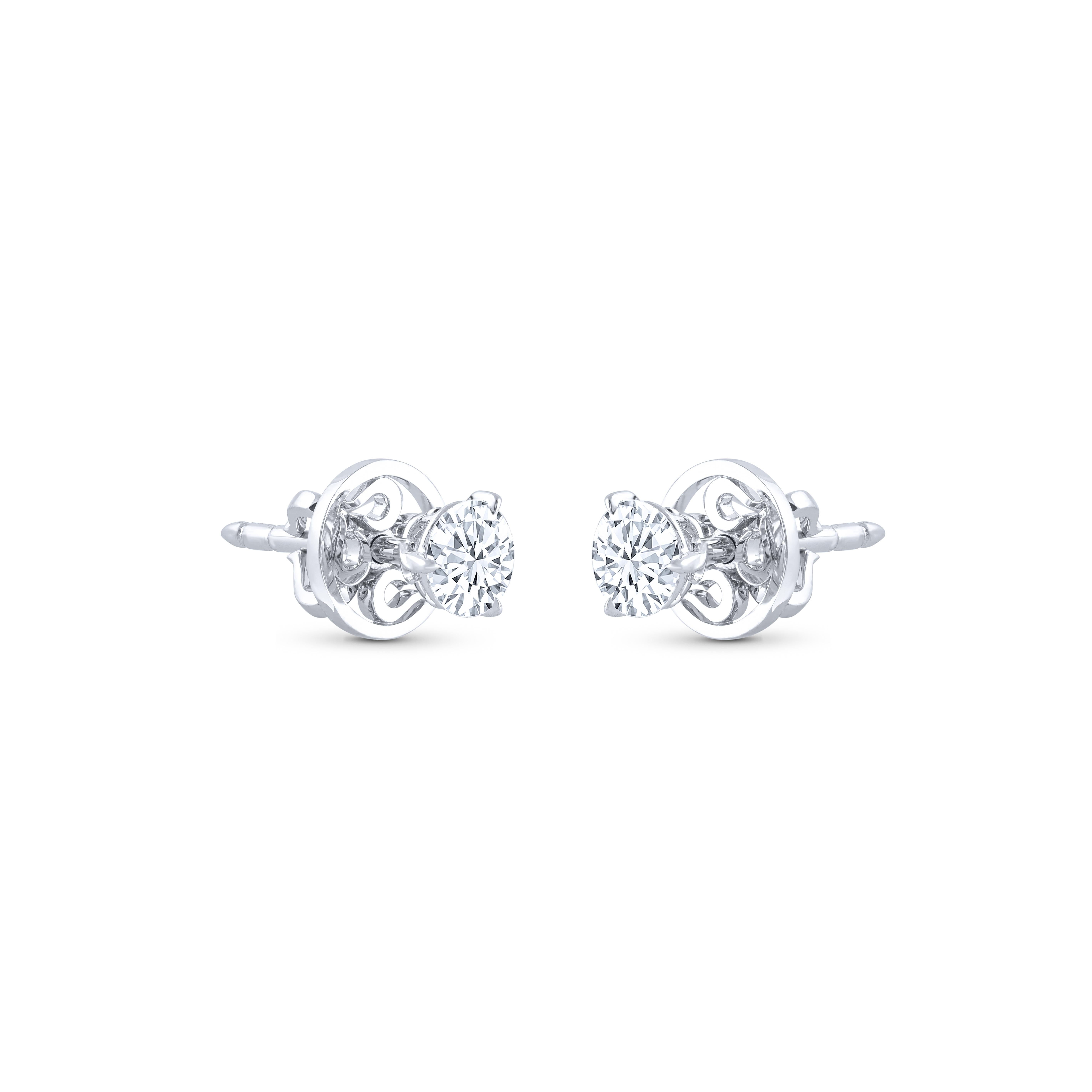 These classic diamond studs showcase a pair of perfectly matched diamonds weighing a total of 0.60 carats. Crafted in 18-karat white gold, these three-prong earrings are available in yellow and rose gold as well. Diamond Grade: F color, VS2