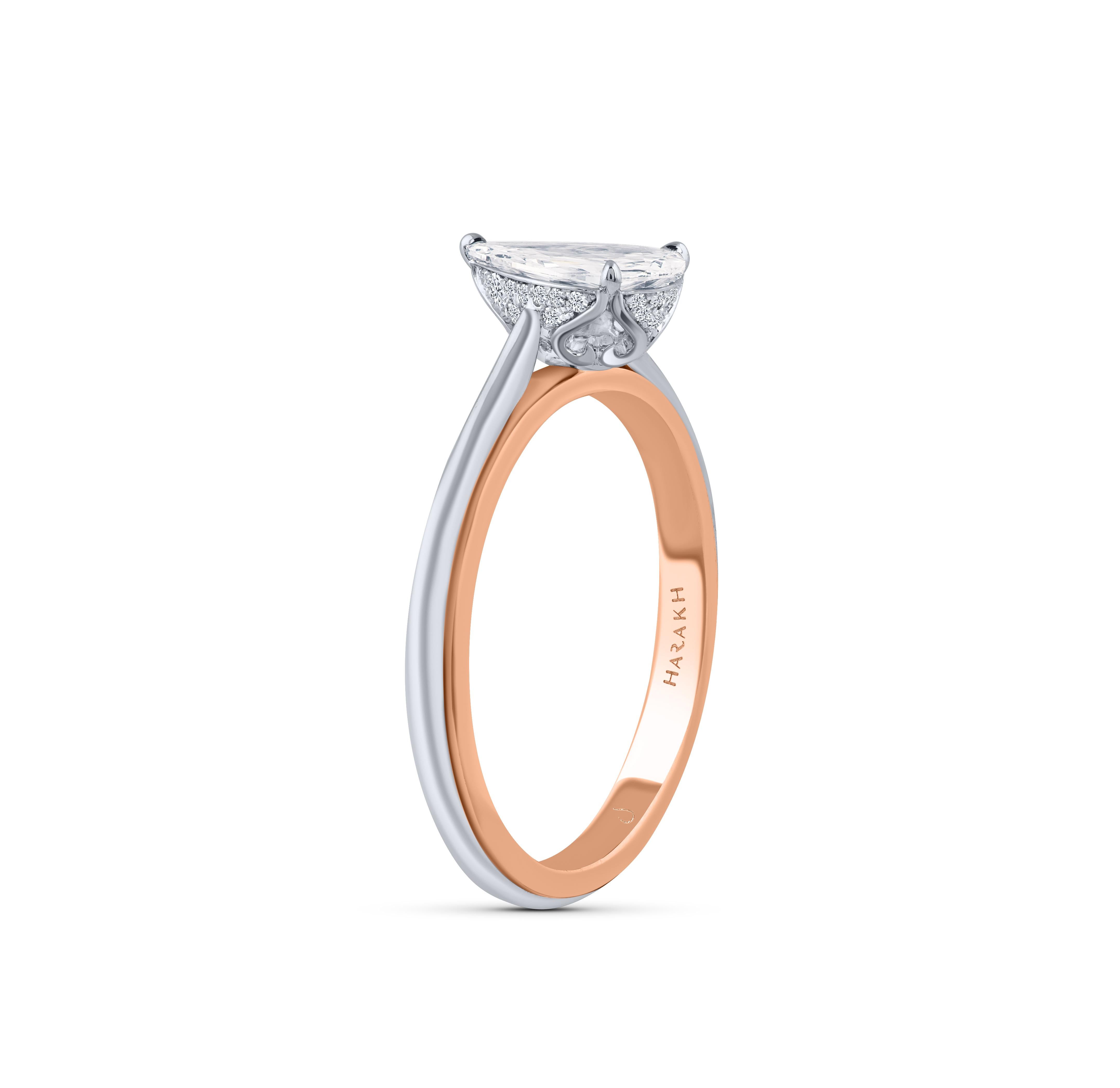 A classic style, this two-tone gold diamond engagement ring is studded with a 0.61 pear shape diamond. All our diamonds are D-F color, IF-VS clarity. This ring will come along with a HARAKH certificate of authentication and a Reflection Card.

This