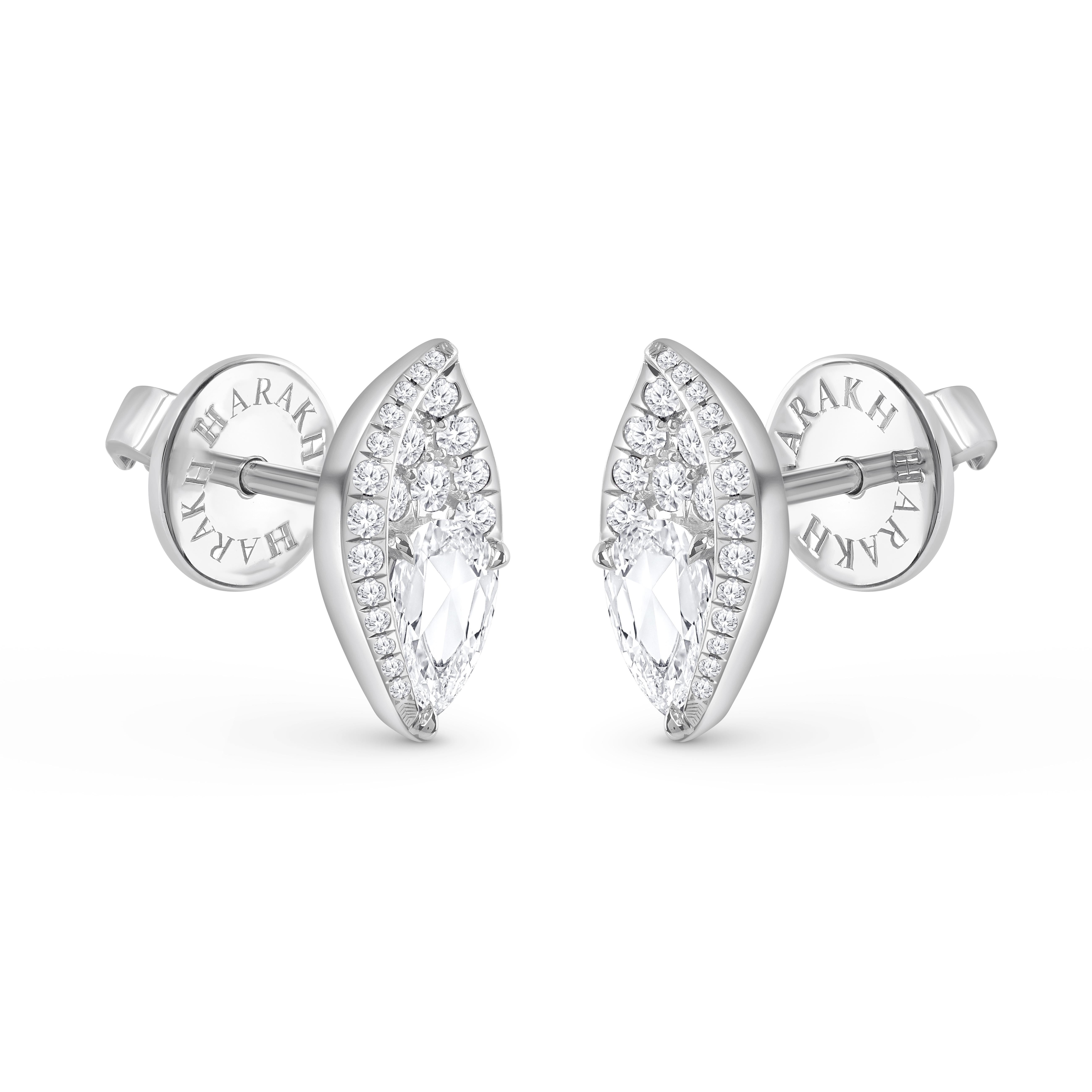 A brilliant cluster of diamonds comes together in these beautiful stud earrings. The diamonds are graded as F color and VS2 clarity. The total diamond weight of the earrings is 3/4 CT and these earrings are meticulously crafted in 18 KT white gold.