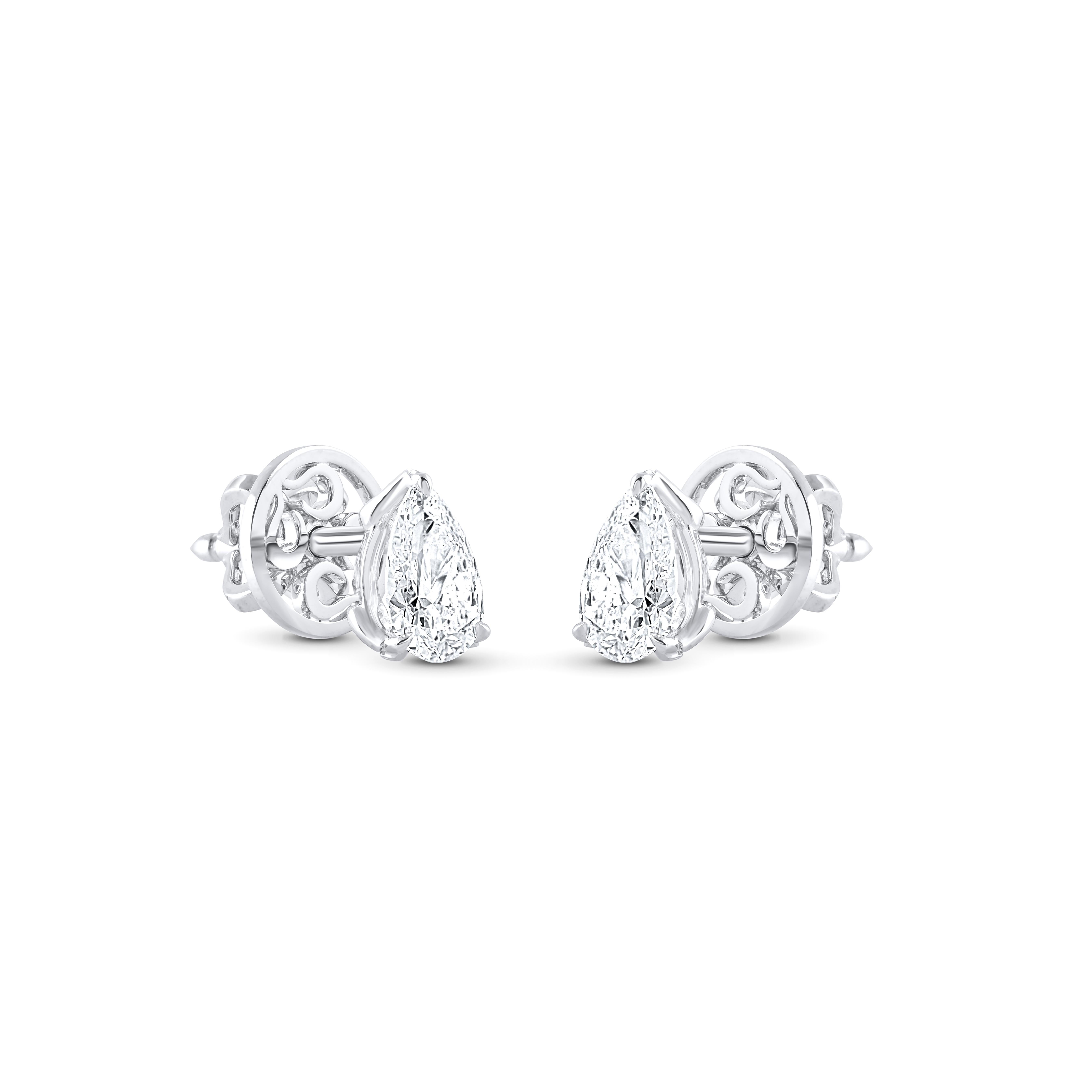 These classic diamond studs feature a perfectly matched pair of pear-shaped diamonds with a total weight of 0.83 carats, set in elegant three-prong settings crafted in 18 KT white gold, with options available in yellow and rose gold. Diamond Grade: