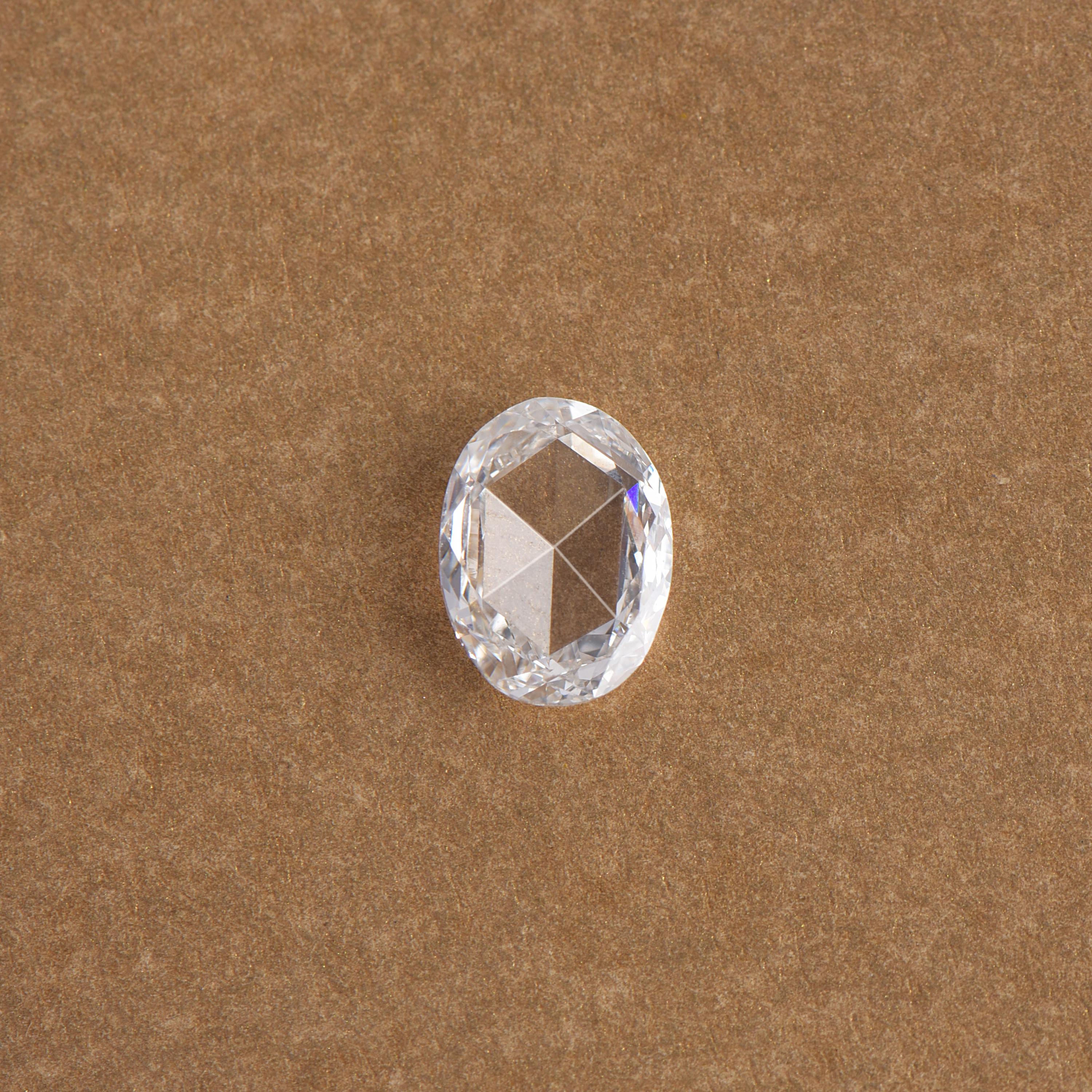 0.85 carat colorless diamond, F color, VS clarity rose cut oval diamond that exhibits transparency and symmetry. Measuring 7.5 x 5.6 mm, this diamond can be set into an engagement ring or any other design of your choice. 

We are pleased to provide