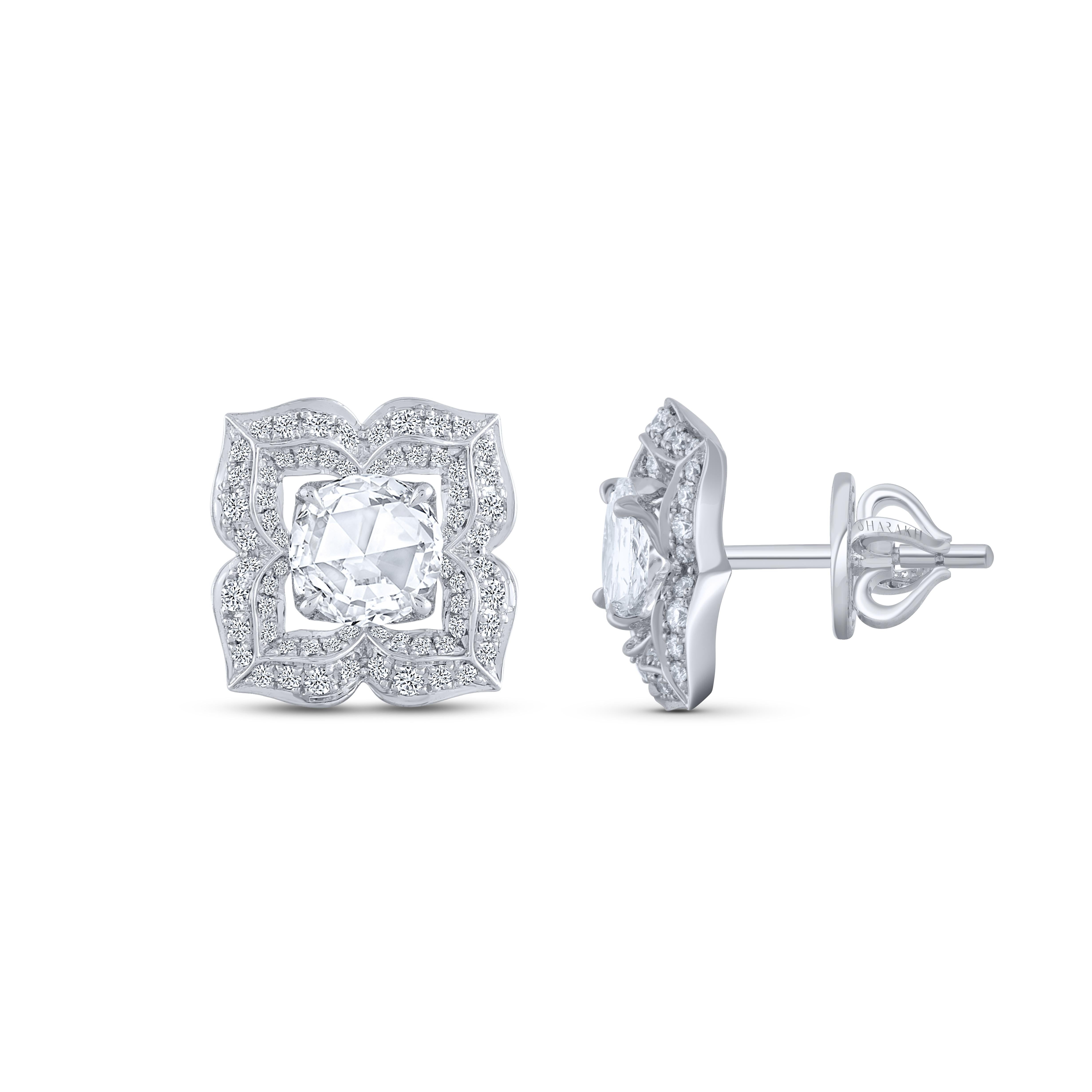 These beautiful earrings are studded with 112 brilliant cut and 2 rose cut diamonds. The total diamond weight of these diamond earrings is 0.94 carats. All the diamonds are D-F color, IF-VS clarity. This white gold stud earrings will come along with