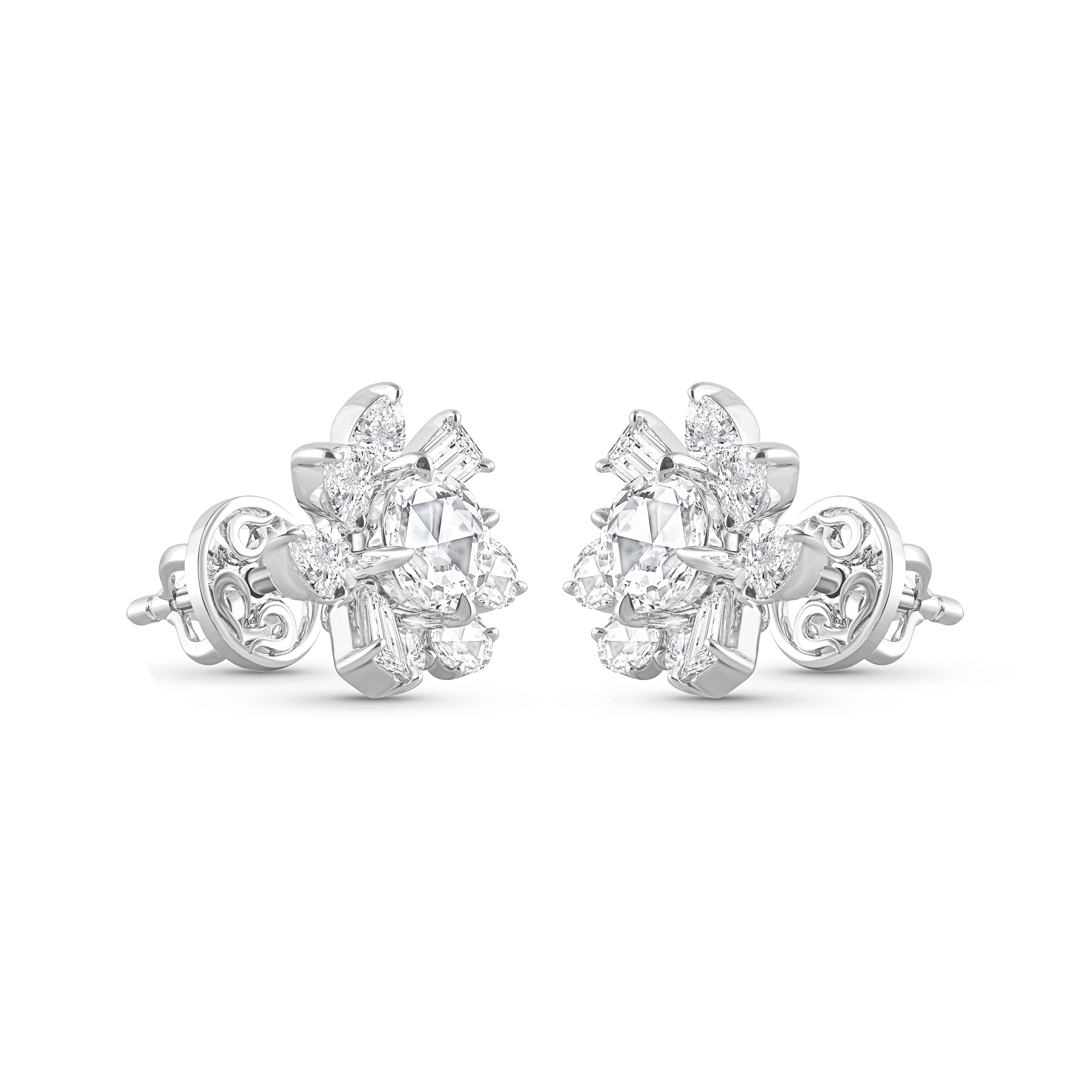 A brilliant cluster of colorless diamonds crafted meticulously to make these statement stud earrings. Studded with 4 round, 4 baguette, 4 pear, 6 rose cut round, and 2 rose cut pear diamonds. All the diamonds are F color, VS2 clarity; the total