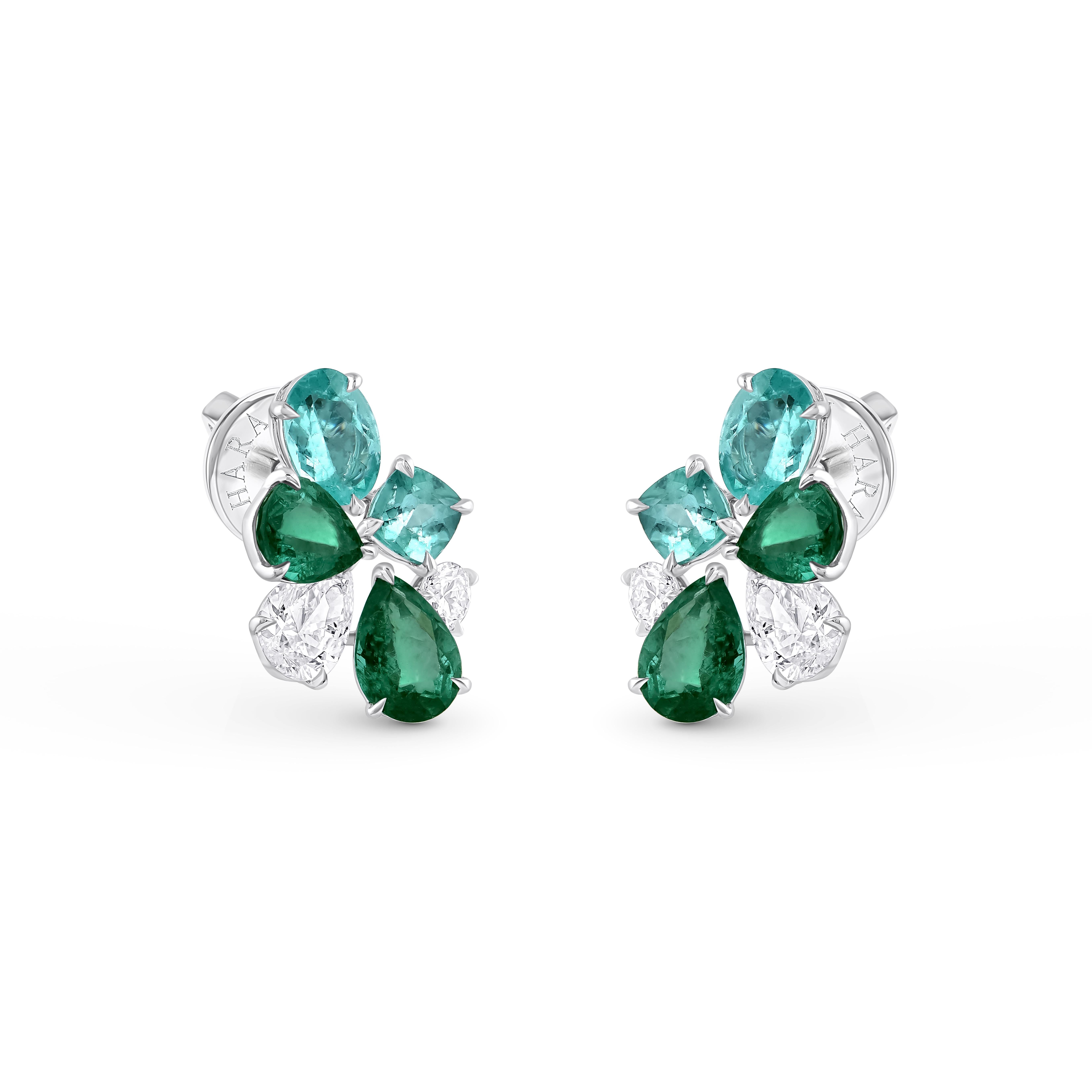 Inspired by the JOY of experiencing a gushing waterfall, these exquisite and elegant dangling earrings from the Cascade Collection are studded with 2 oval and 2 cushion Paraiba, 4 Emerald and Diamonds 2 brilliant-cut and 2 pear-cut diamonds dripping