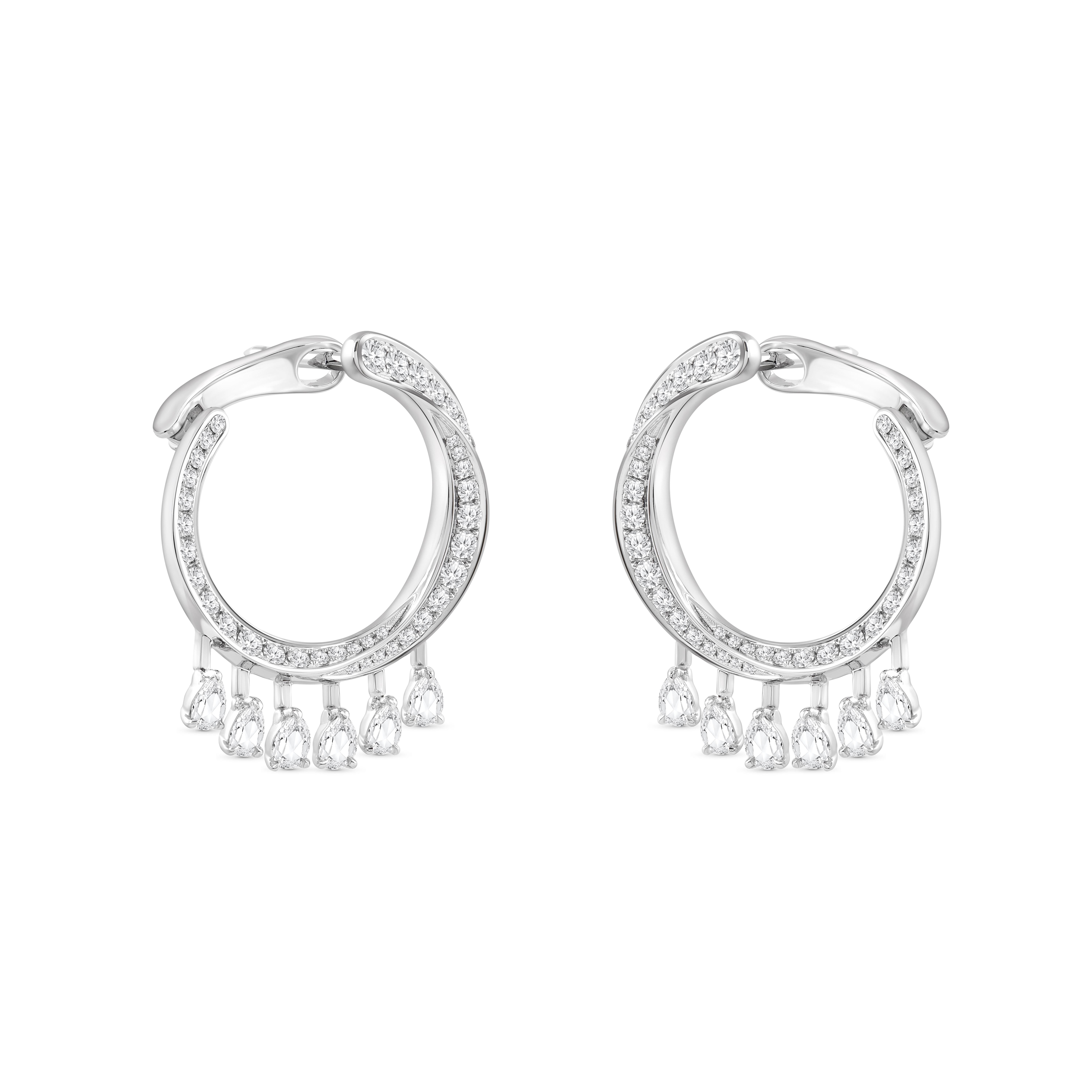 Inspired by the JOY of experiencing a gushing waterfall, these exquisite and elegant dangling earrings from the Cascade Collection are studded with 90 brilliant-cut and 12 rose-cut pear diamonds dripping delicately.

Beautifully designed, these