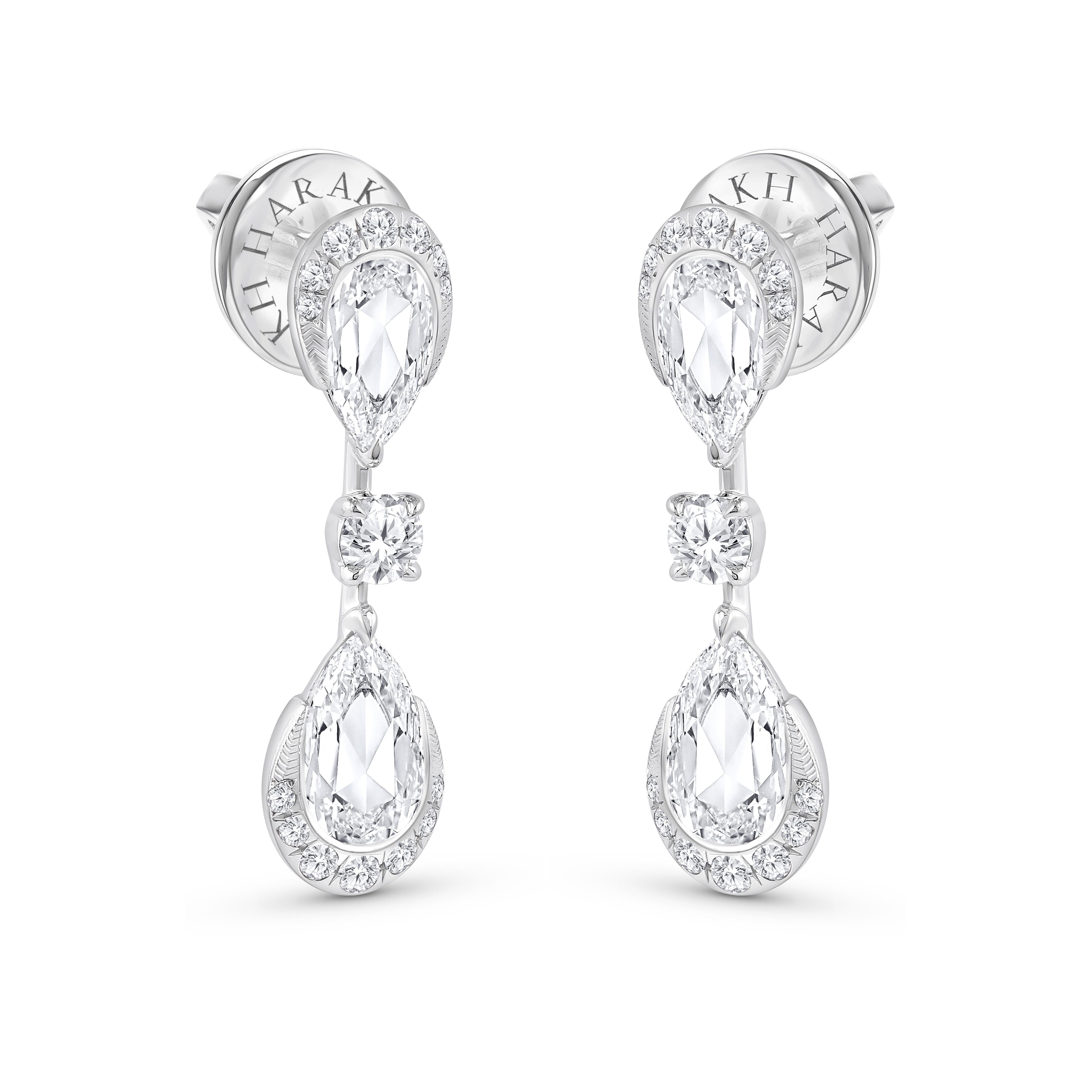 Inspired by the JOY of experiencing a gushing waterfall, these cascade earrings are studded with brilliant and rose cut diamonds dripping delicately. The diamonds are graded as F color and VS2 clarity. The total diamond weight of the earrings is 1
