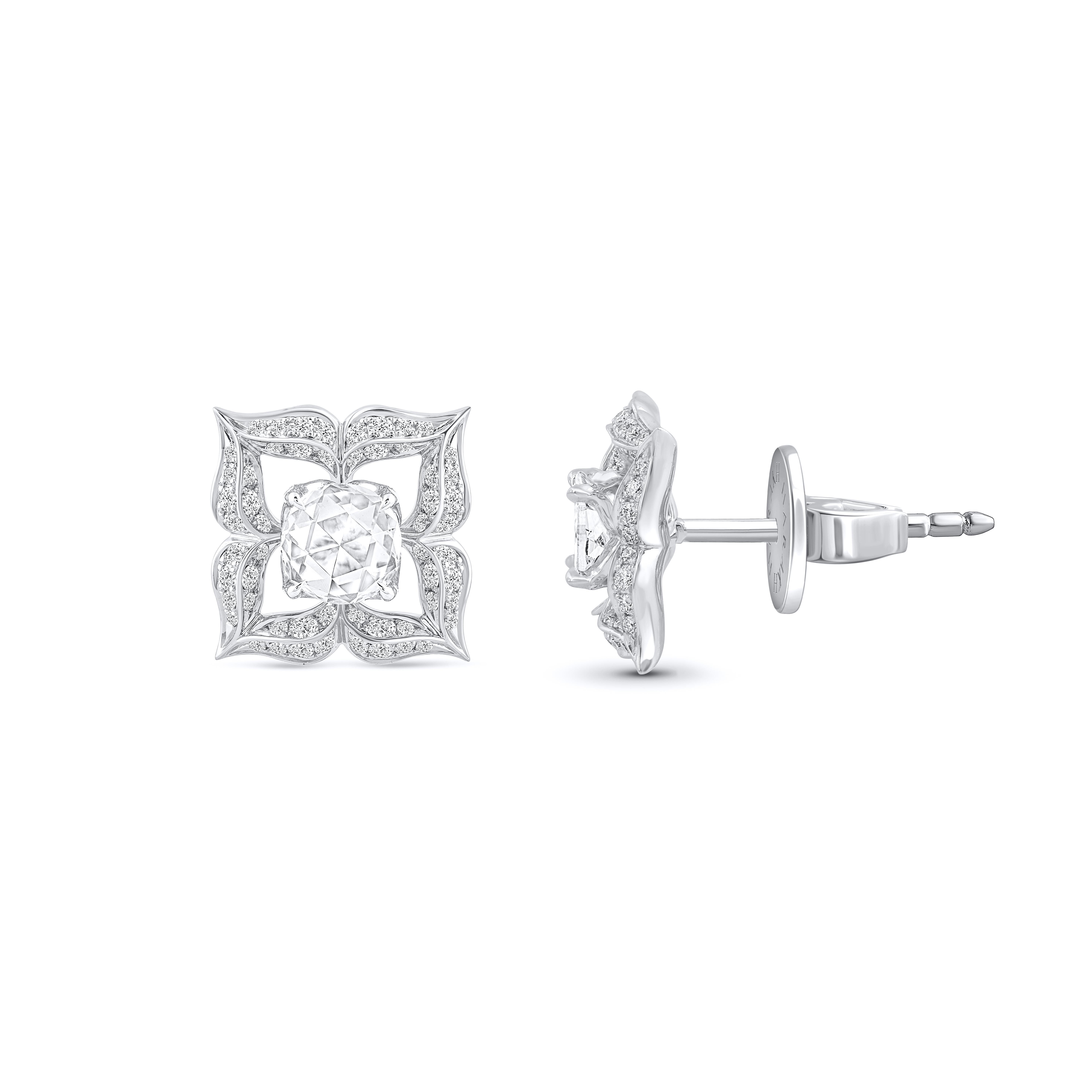 These beautiful earrings are studded with 112 brilliant cut and 2 rose cut diamonds. The total diamond weight of these diamond earrings is 1.00 carats. All the diamonds are F color, VS2 clarity. This white gold stud earrings will come along with a