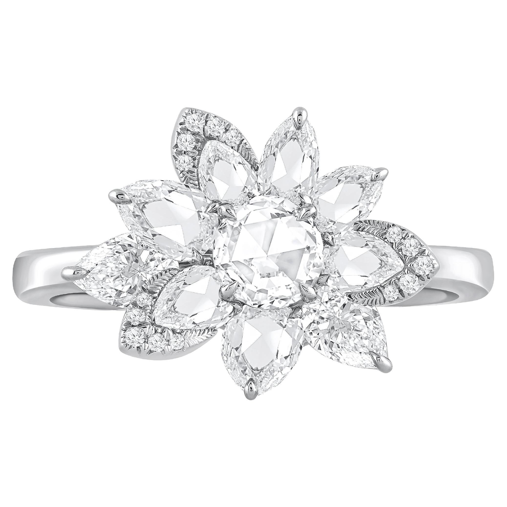 Inspiriert von der Freude, einen rauschenden Wasserfall zu erleben, ist dieser exquisite und elegante Clusterring aus der Collection'S Cascade mit 2 Birnenbrillanten, 16 runden Brillanten, 7 Birnen im Rosenschliff und 1 runden Diamanten im