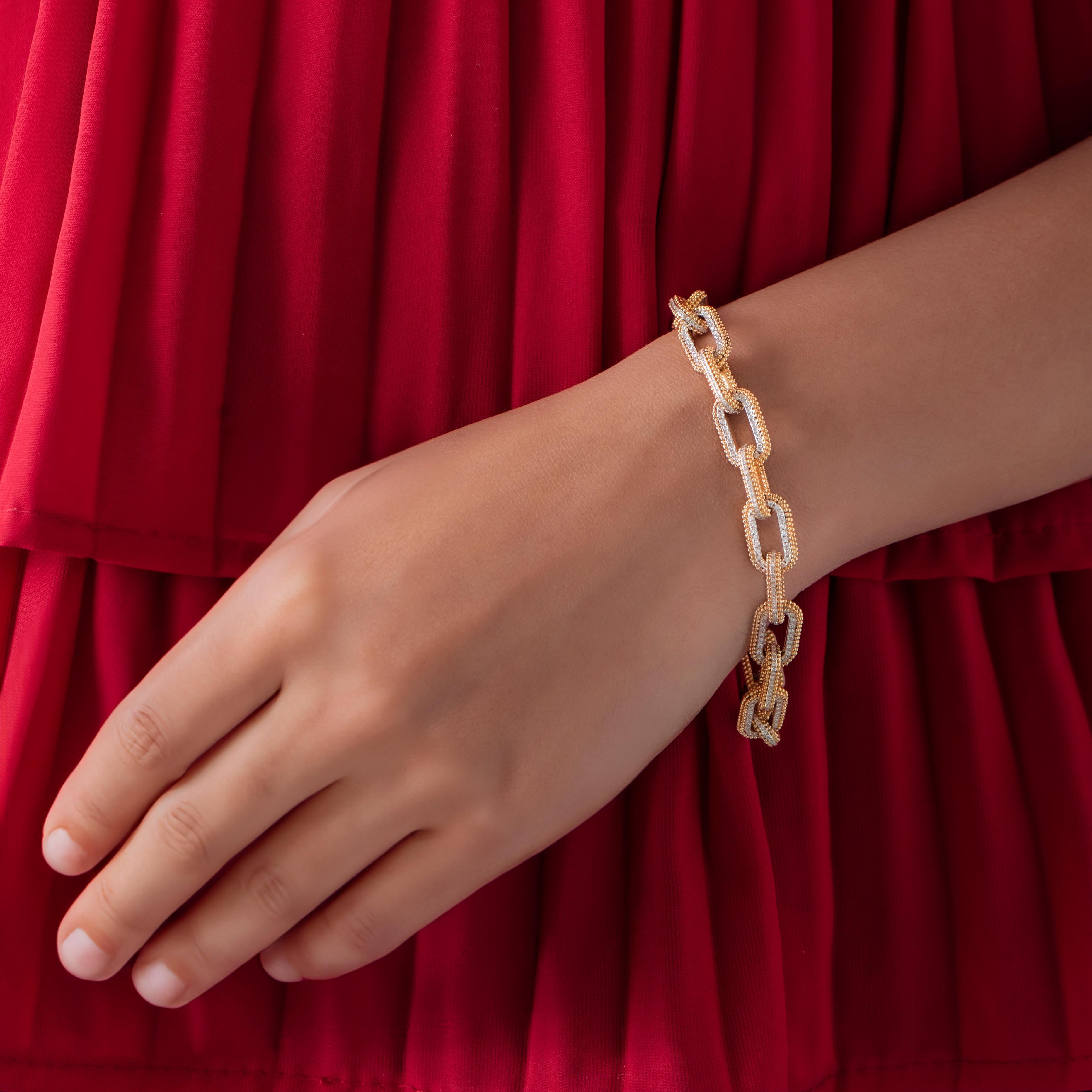 Inspired by the journey of the sun’s rays traveling through space and time to brighten our world, brilliant cut round diamonds are set in 18 KT Yellow gold. An artisanal form of embroidery known as pota is recreated especially for gold using
