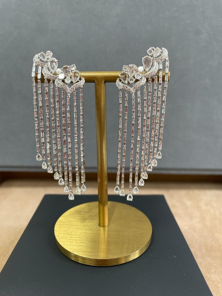 These classic haveli stud earrings are studded with 112 brilliant cut, 274 Baguette, 10 Rose-cut Round, 26 Rose-cut Pear and 4 pear diamonds. The total diamond weight of these diamond earrings is 7.45 carats. All the diamonds are D-F color, IF-VS