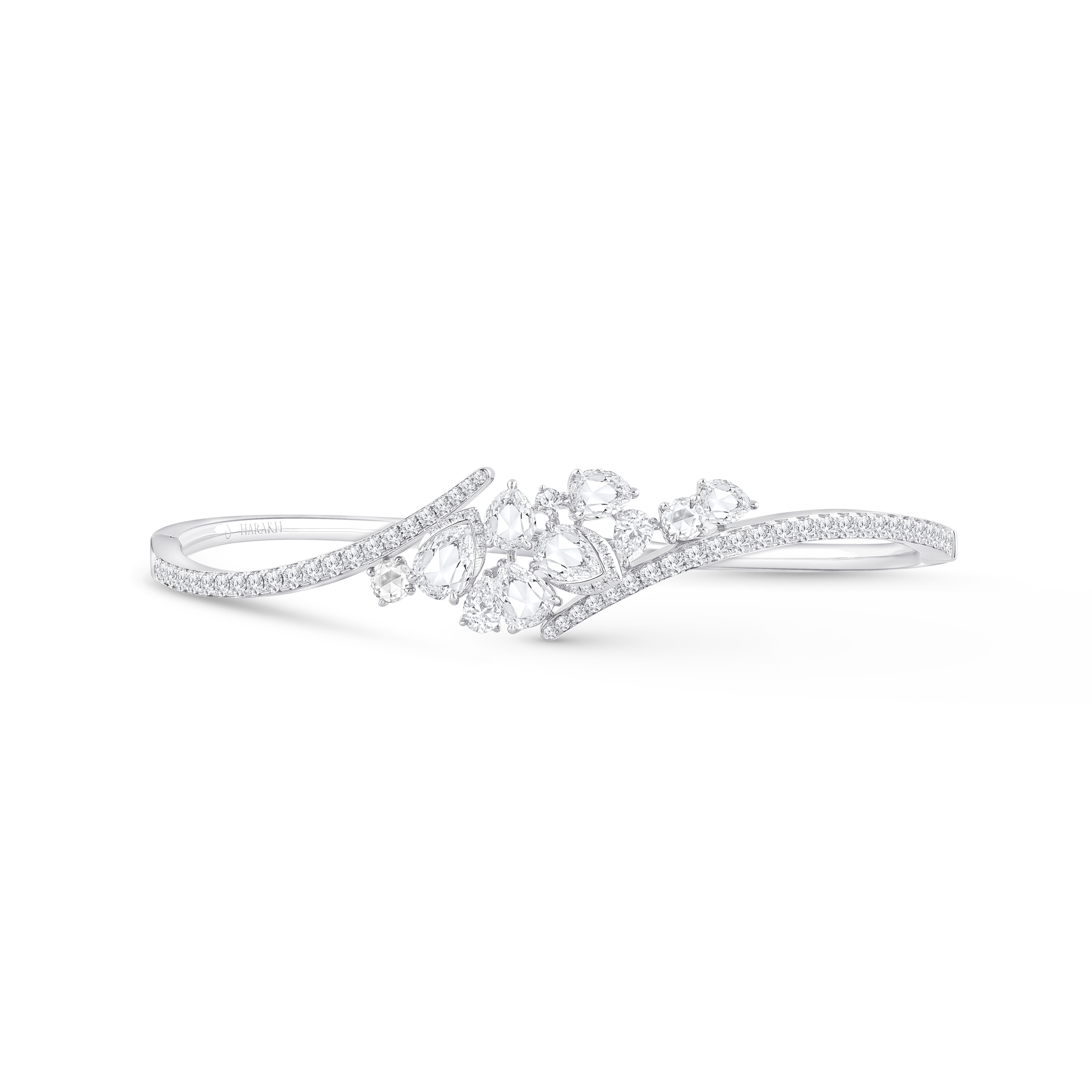 Inspired by the JOY of experiencing a gushing waterfall, this bracelet is elegantly designed and studded with round, pear, and fancy cut colorless diamonds. It is perfect for daily wear. Pair with other bracelets and bangles to create a stylish