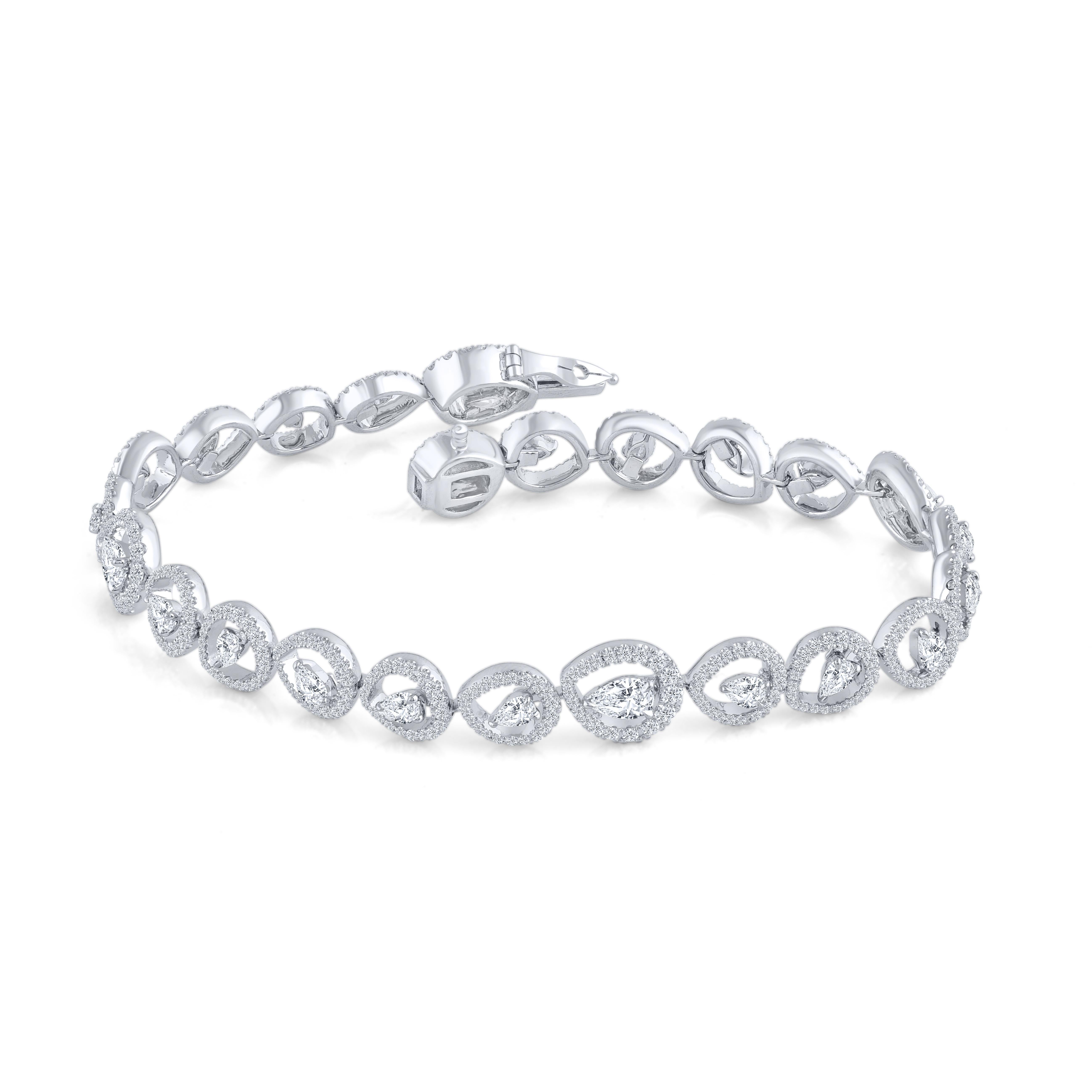 A beautiful tennis bracelet featuring a total of exquisite 480 colorless diamonds – 456 brilliant cut diamonds and 24 pear shape diamonds set in 18 KT white gold. 

All are diamonds are graded D-F color, IF-VS clarity. This piece will be accompanied