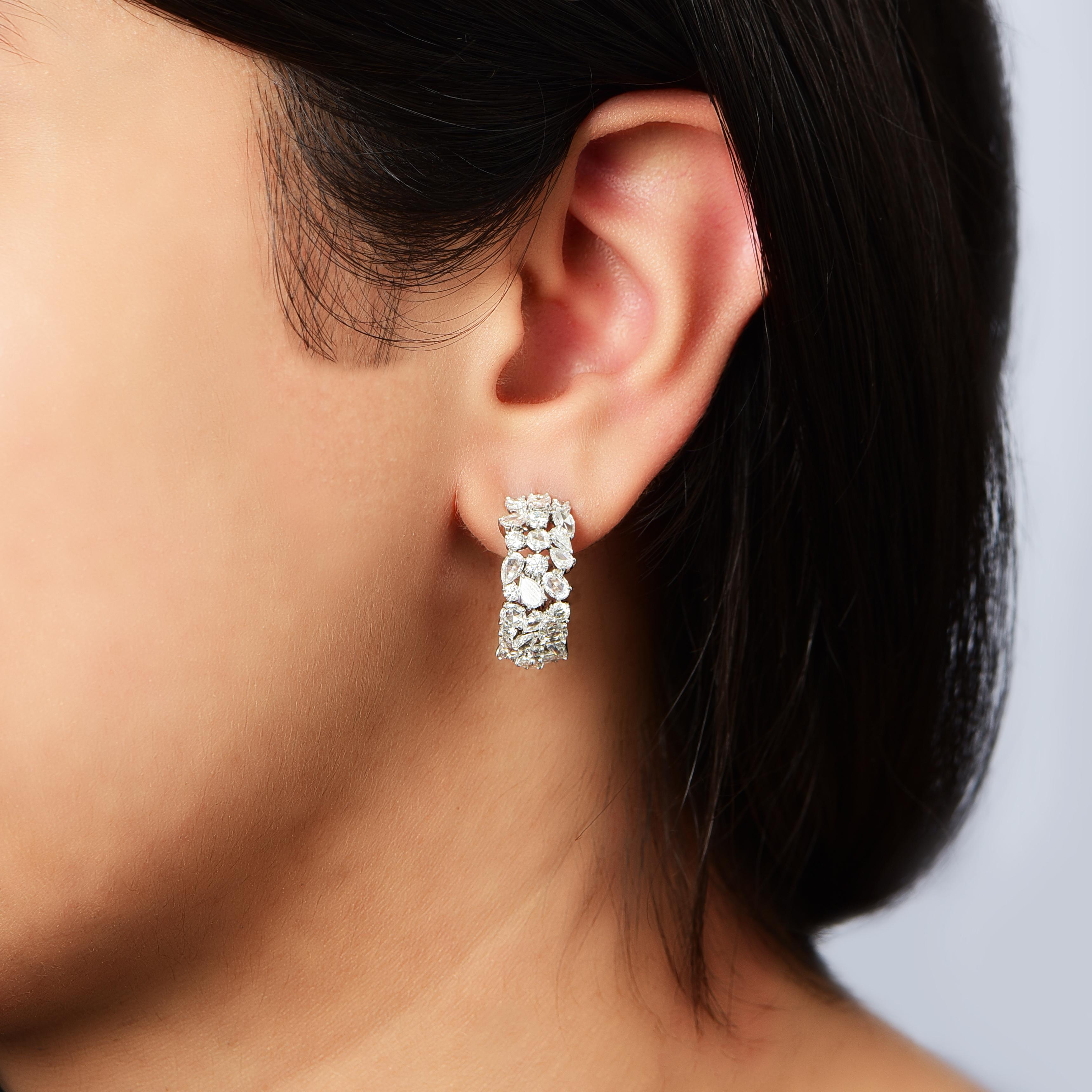 A brilliant cluster of diamonds comes together in these beautiful climber earrings. Studded with 20 round, 2 pear, 6 rose cut round, 6 rose cut oval and 20 rose cut pear diamonds, D-F color, IF-VS clarity. The total diamond weight of the earrings is