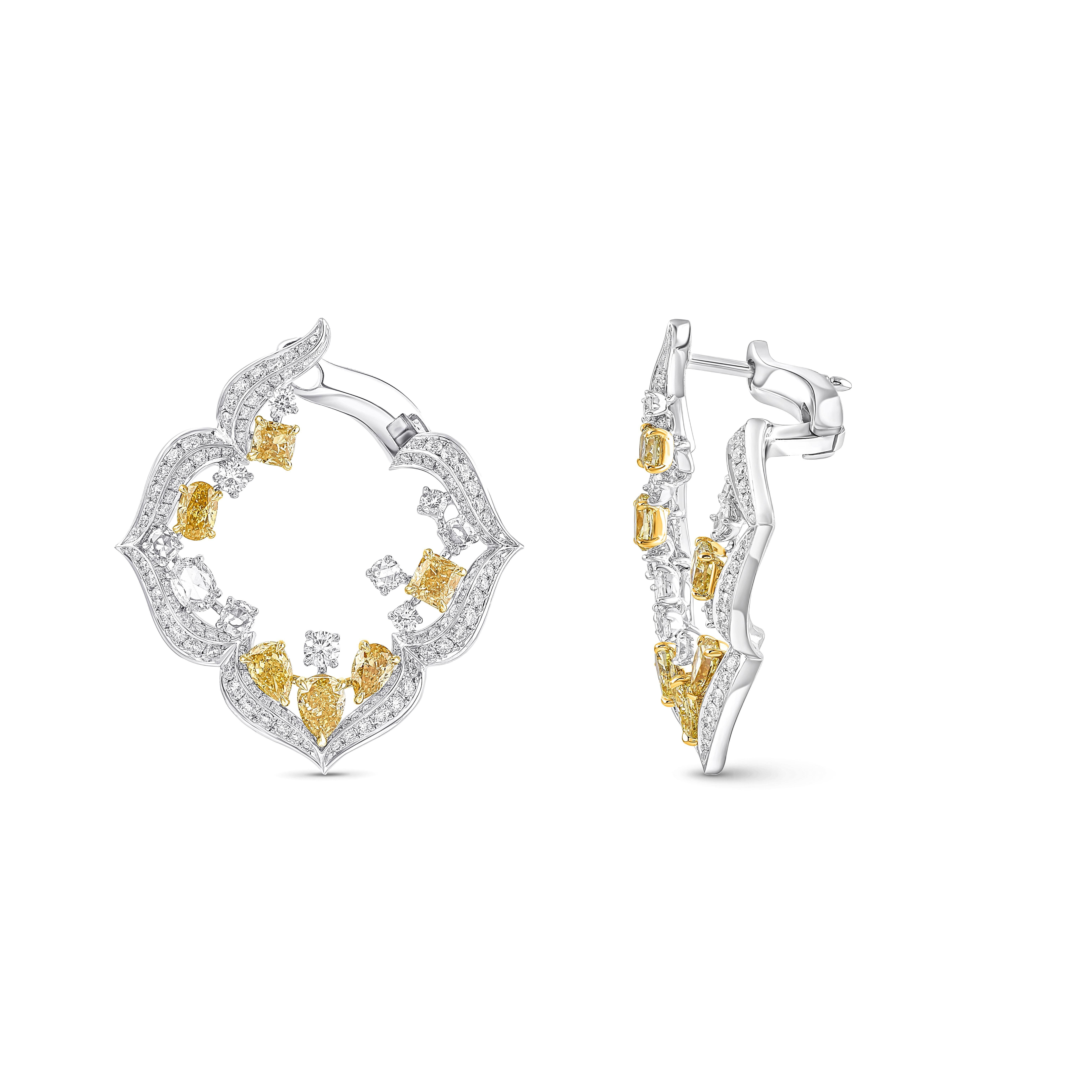 Inspired by the sacred symbols that invoke divinity, each pair is meticulously adorned with a stunning combination. Each pair of earrings are adorned with a harmonious blend of stunning diamonds, featuring: 240 Round Brilliant Diamonds,  8 Brillant