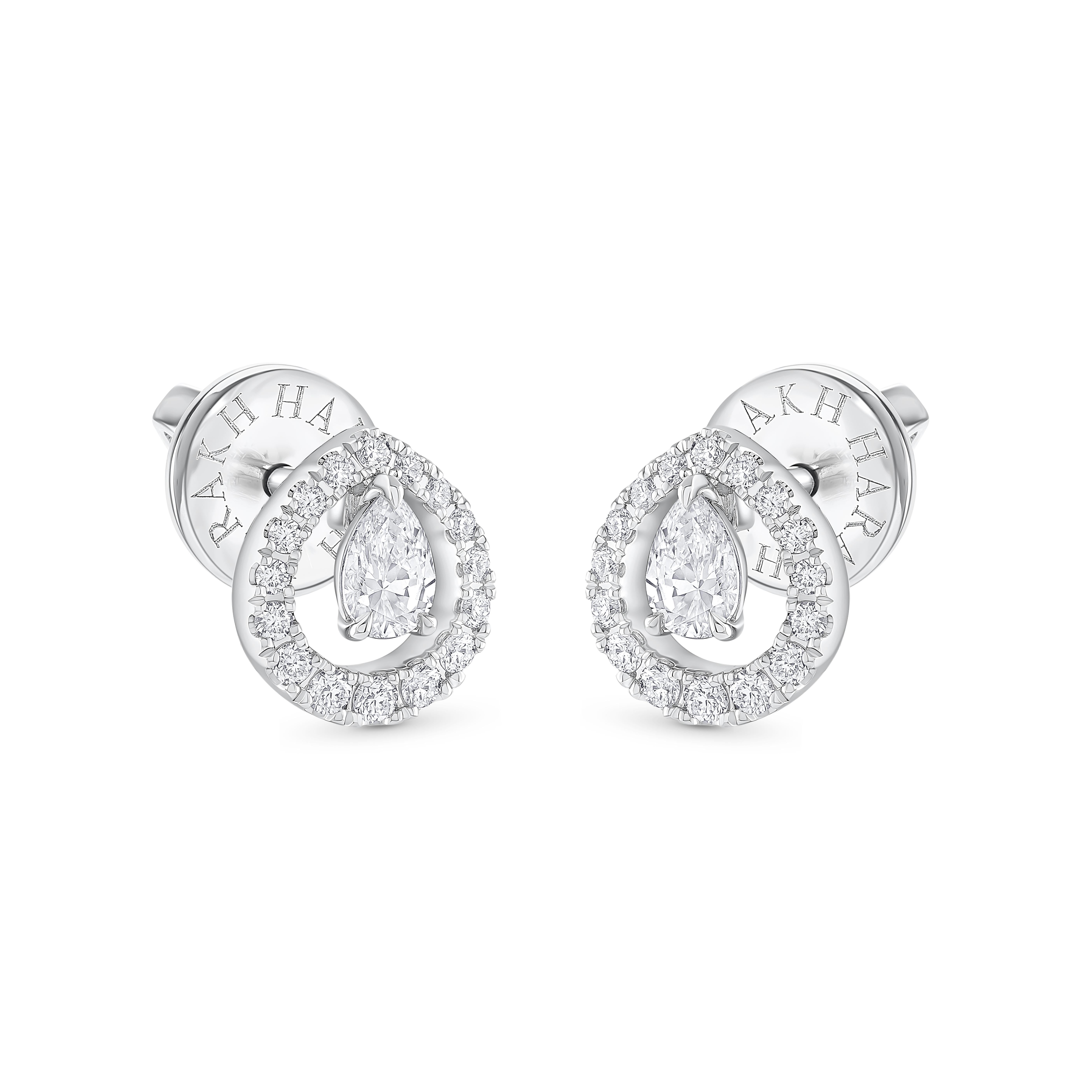 These simple yet sophisticated diamond earrings are studded with 32 round and 2 pear-shaped diamonds in a prong setting, crafted in 18 kt white gold. Specially crafted to sway gently with every movement, it secures comfortably with a guardian post