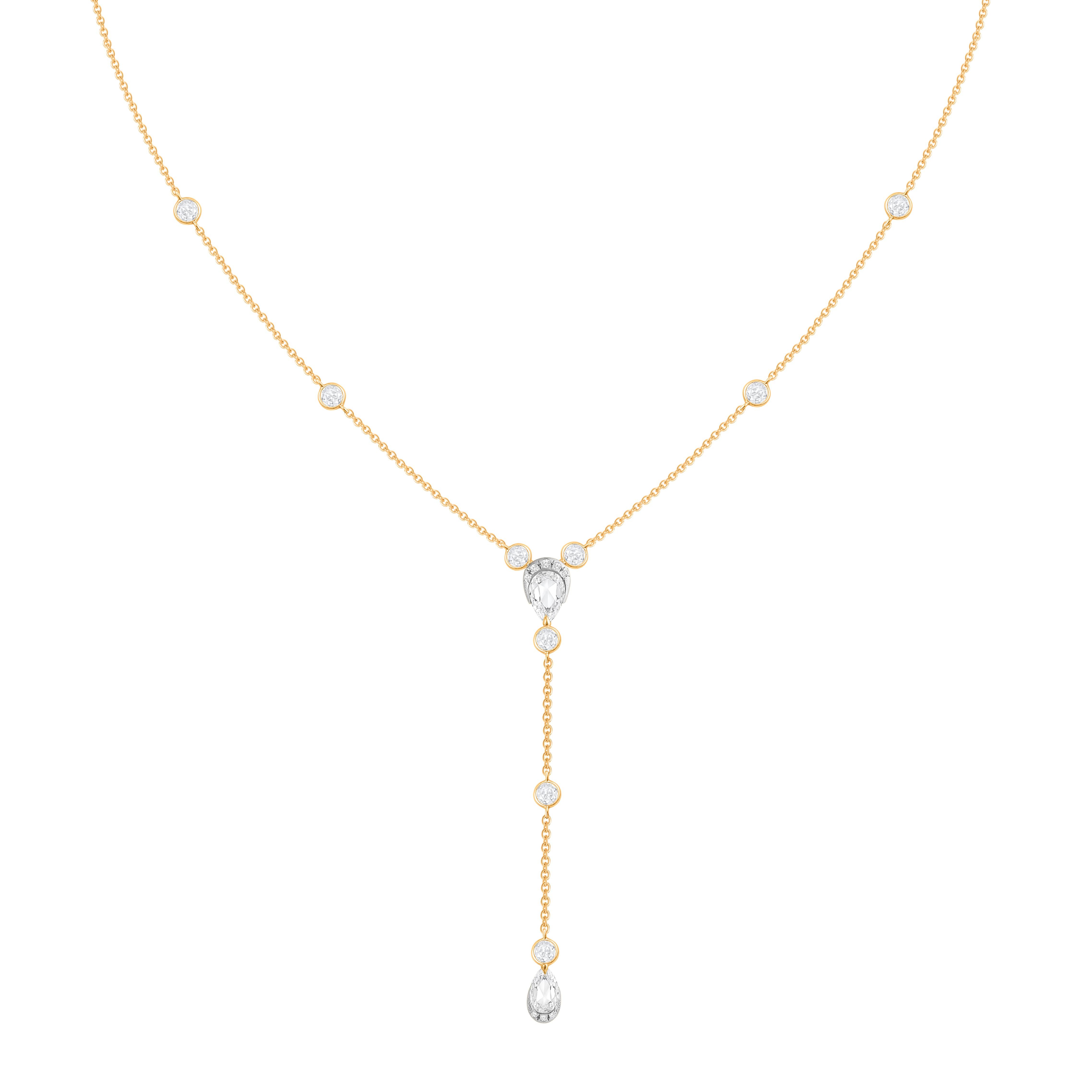 Inspired by the JOY of experiencing a gushing waterfall, this contemporary station necklace is crafted in 18KT Yellow Gold and studded with a Combination of Brilliant & Rose cut colorless diamonds. The total diamond weight is 5/8 carats. All our