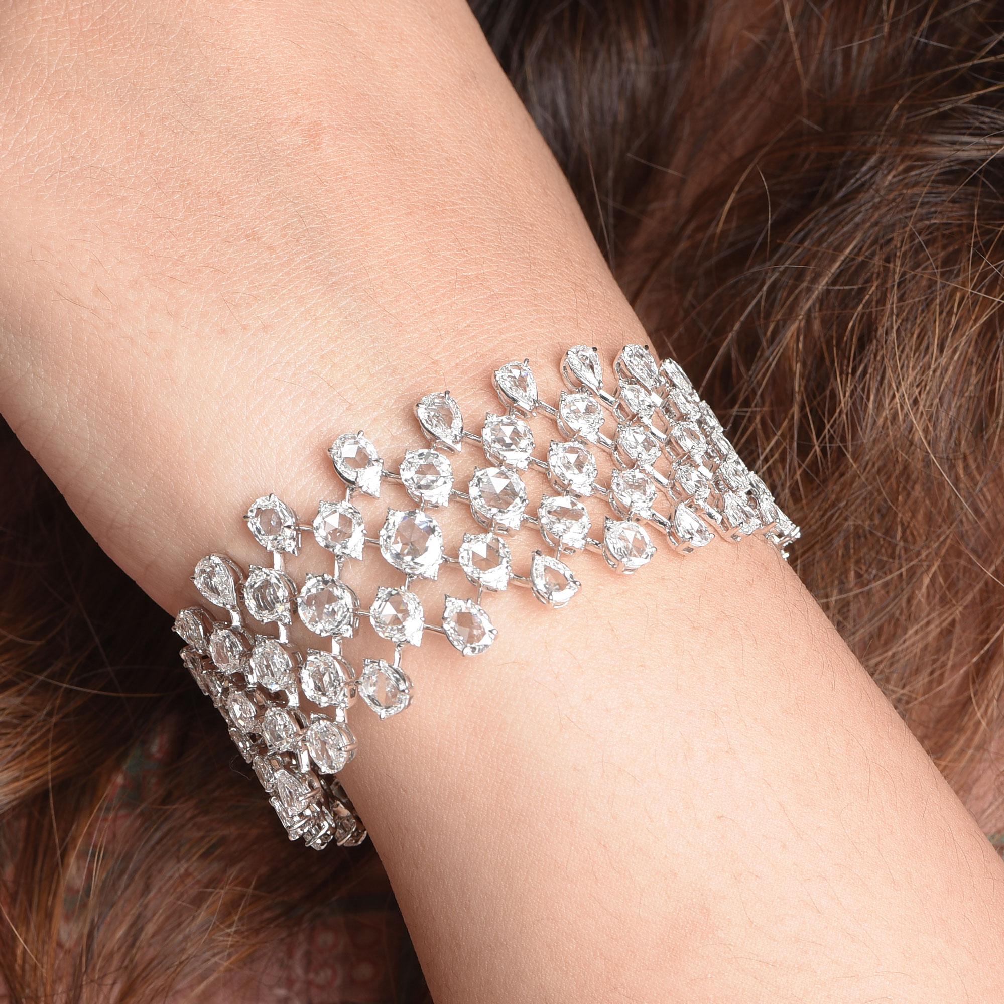 This exquisite bracelet from our Haveli (Royal abode) collection is embellished with an array of brilliant and rose cut diamonds. It is studded with 159 brilliant round, 66 rose cut round, 23 rose cut pear and 15 rose cut oval diamonds, crafted to