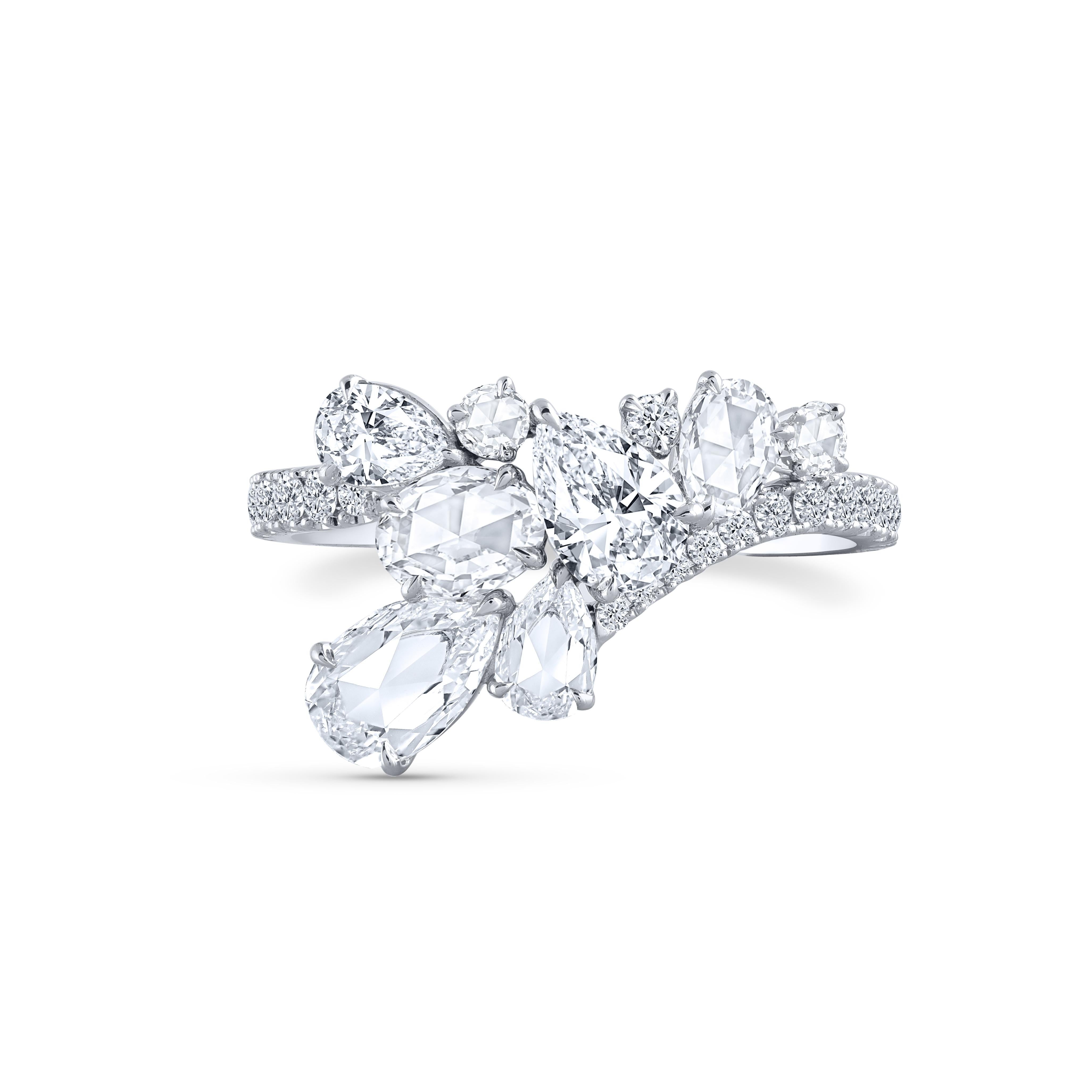 A beautiful arrangement of brilliant and rose cut diamonds come together to create this ring which is a part of our Cascade collection. Studded with 30 round, 3 pear, 1 rose cut round 2 rose cut pear diamonds. 

Inspired by the beauty of the