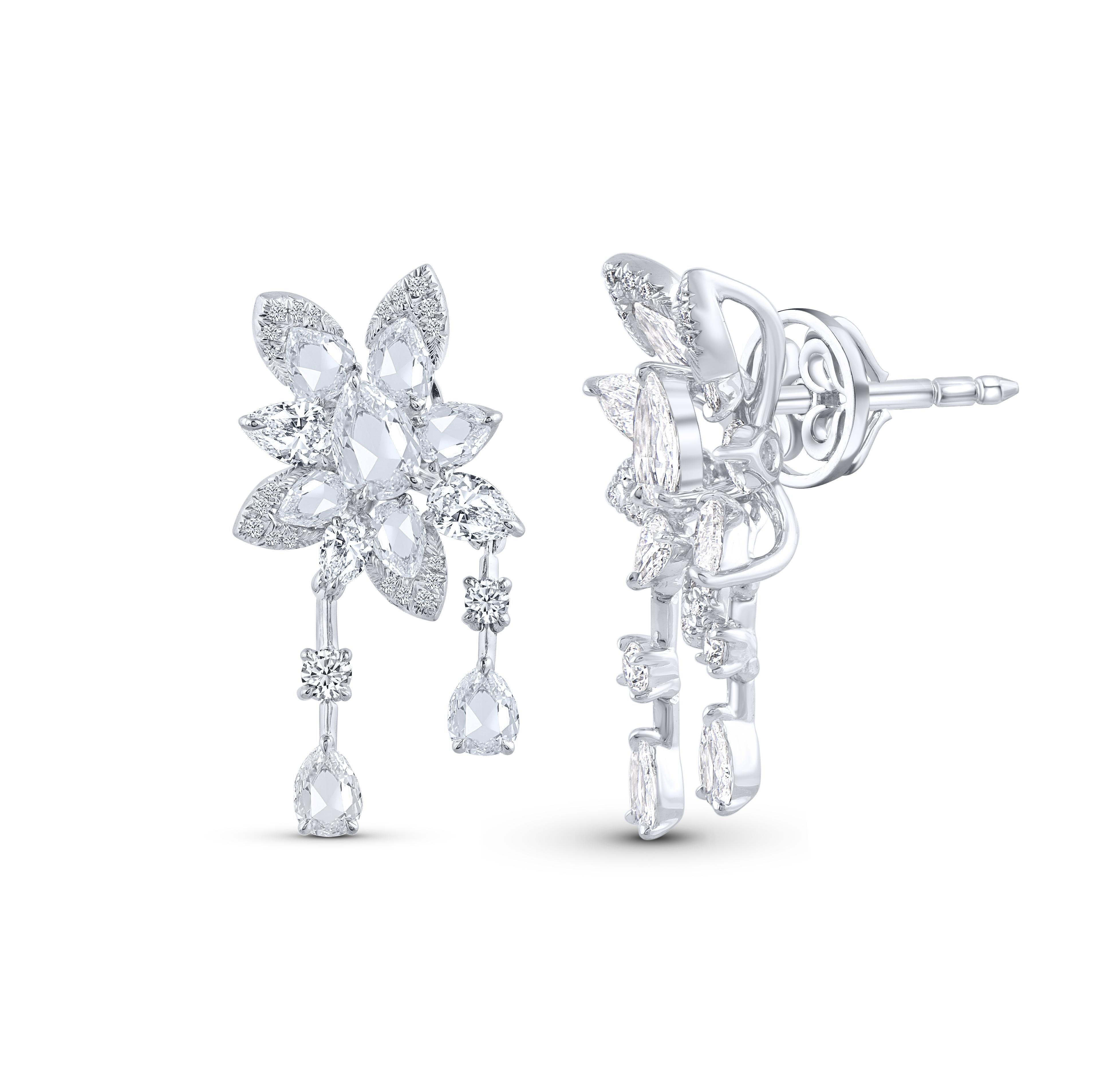 A beautiful arrangement of brilliant and rose cut diamonds come together to create these drop earrings which is a part of our Cascade collection. Studded with 44 round, 6 pear and 16 rose cut pear diamonds. 

Inspired by the beauty of the naturally