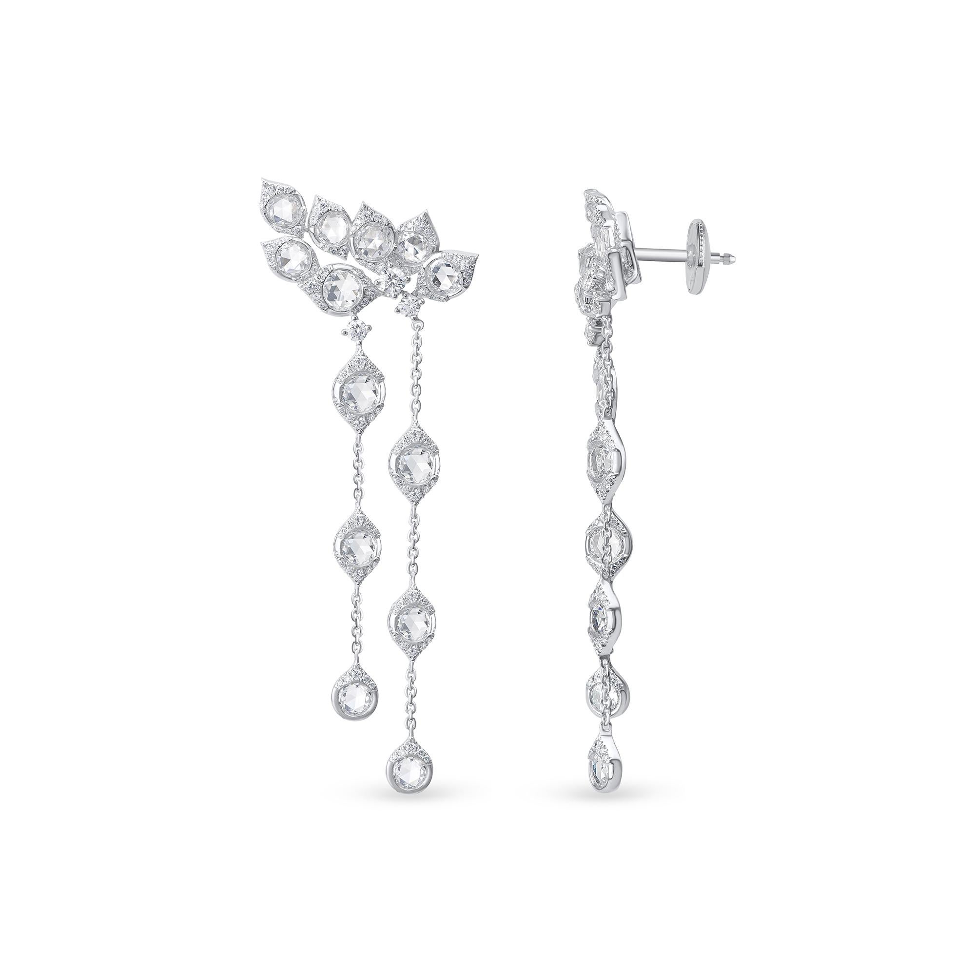Inspired by the grand Indian havelis of yesteryear, these dangling earrings have an architecturally inspired drop silhouette set with stunning rose-cut diamonds. Crafted in 18 KT yellow gold, studded with 246 round and 26 rose cut round natural