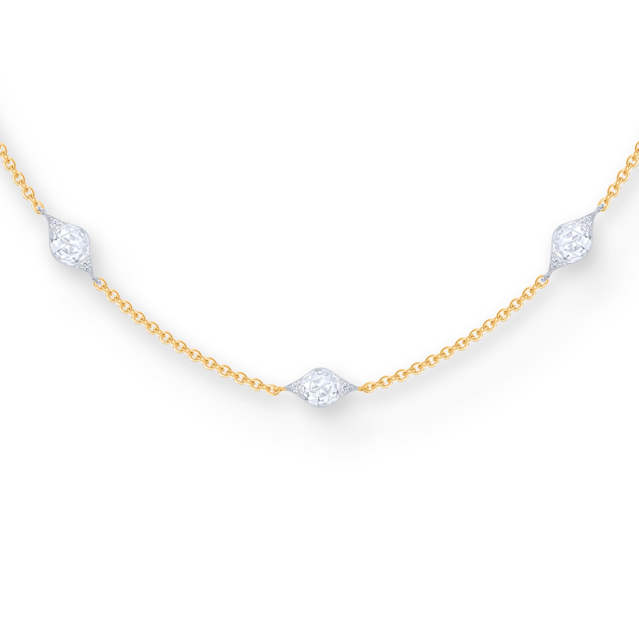 Inspired by the grand Indian havelis of yesteryear, this contemporary station necklace is crafted in 18 KT yellow gold and studded with 60 brilliant cut and 15 rose cut round diamonds. The total diamond weight is 1.40 carats. All our diamonds are