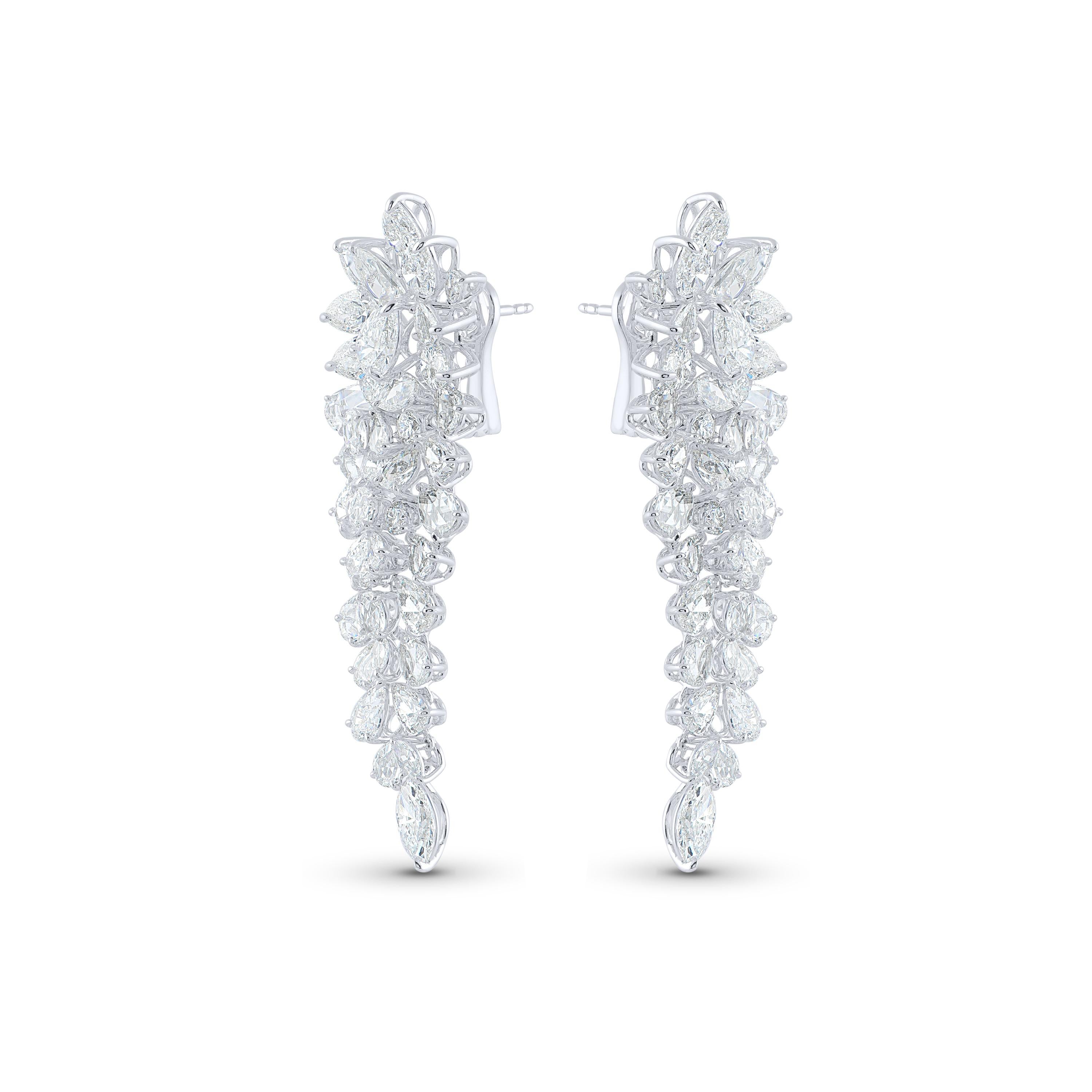 These 18 ct dangling clusters of brilliant-cut round, pear- and marquise-shaped diamonds, interspersed with Harakh’s signature rose-cut round and pear-shaped stones. Crafted in 18 KT white gold (Paladium alloyed). 

These earrings are studded with a