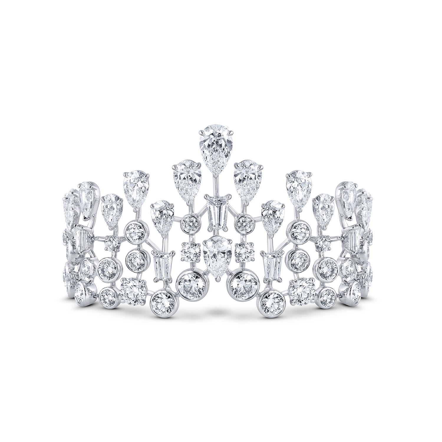 This beautifully designed Cuff from our Raindrop Collection is studded with 83 brilliant cut round diamonds, 38 brilliant cut pear diamond and 13 baguette cut diamonds, crafted in claw setting with the total diamond weight of 24.00 CT. The diamonds