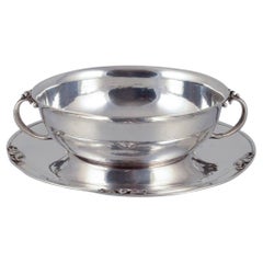 Harald Nielsen for Georg Jensen. Sterling silver bowl with handles on a saucer. Antique Harald Nielsen for Georg Jensen. Sterling silver bowl with handles on a saucer.
