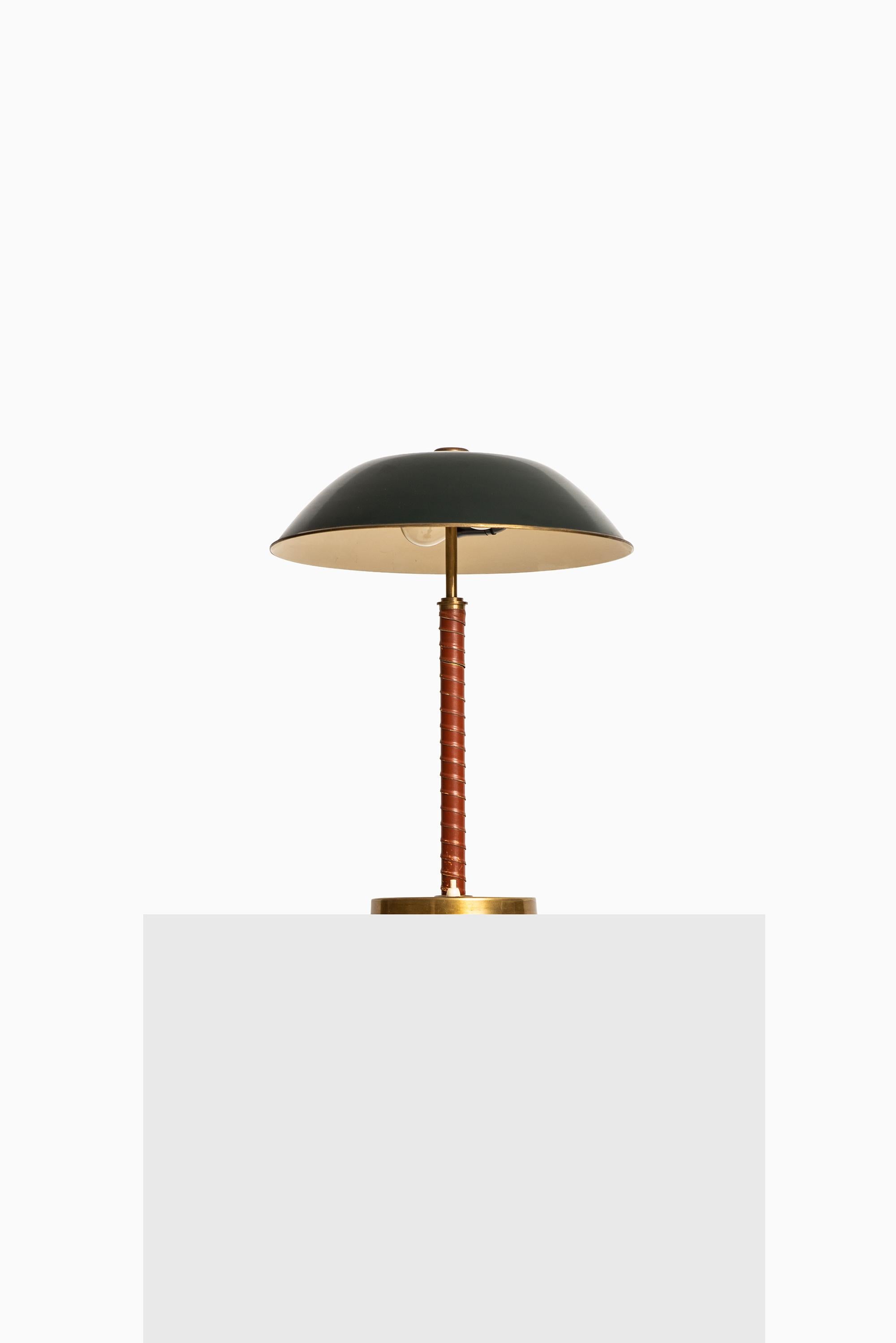 Rare table lamp attributed to Harald Notini. Produced by Böhlmarks in Sweden.