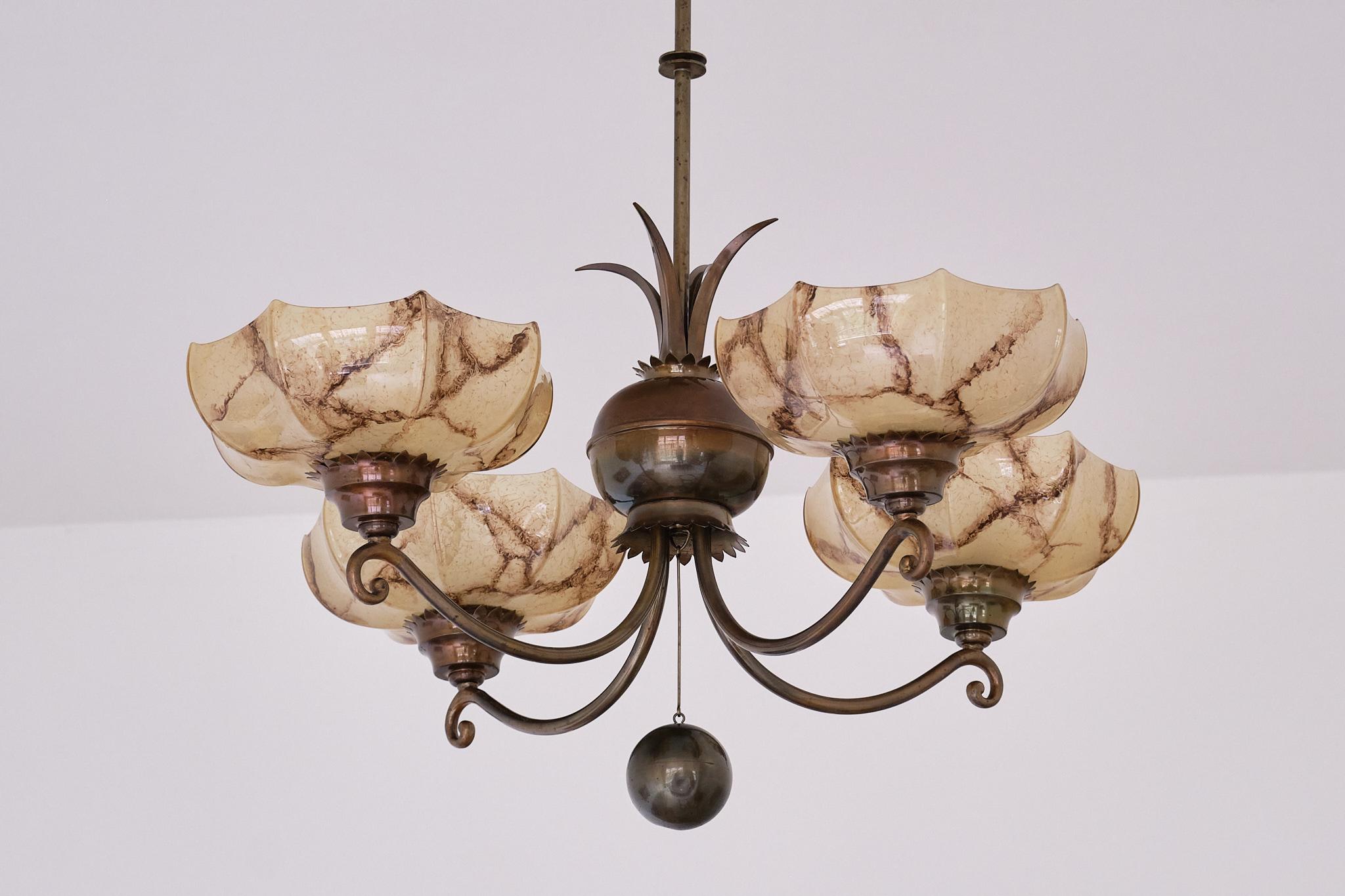 This striking four arm chandelier was designed by Harald Notini and produced by Arvid Böhlmarks Lampfabrik in Sweden, circa 1927.  This particular model numbered 6316 is a great example of the unique Swedish Grace style of this period.

The striking