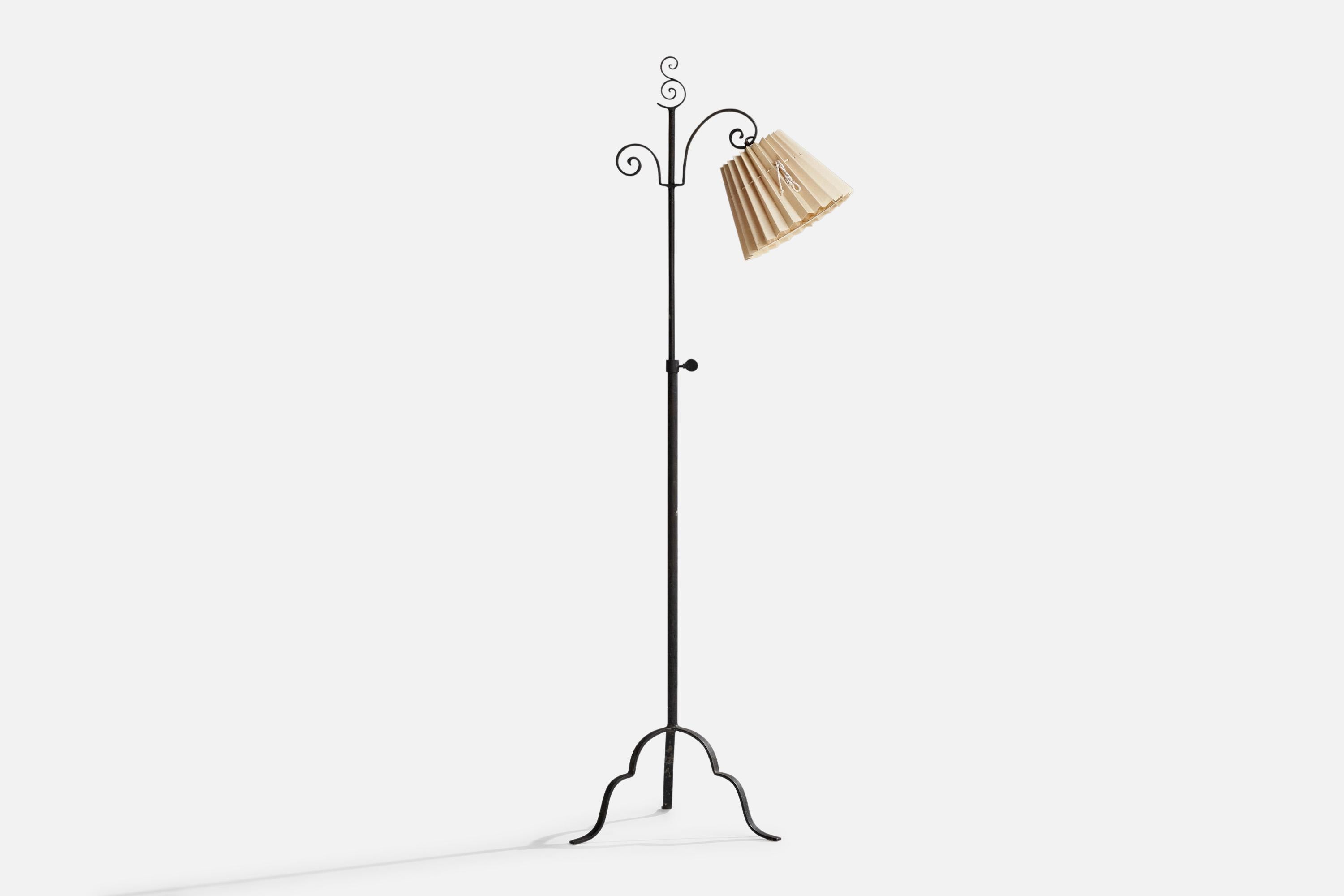 An adjustable wrought iron and beige fabric floor lamp, Model 15101, designed by Harald Notini and produced by Böhlmarks, Sweden, 1930s.

Overall Dimensions (inches): 60.5”  H x 16”  W x 23” D
Stated dimensions include shade.
Bulb Specifications: