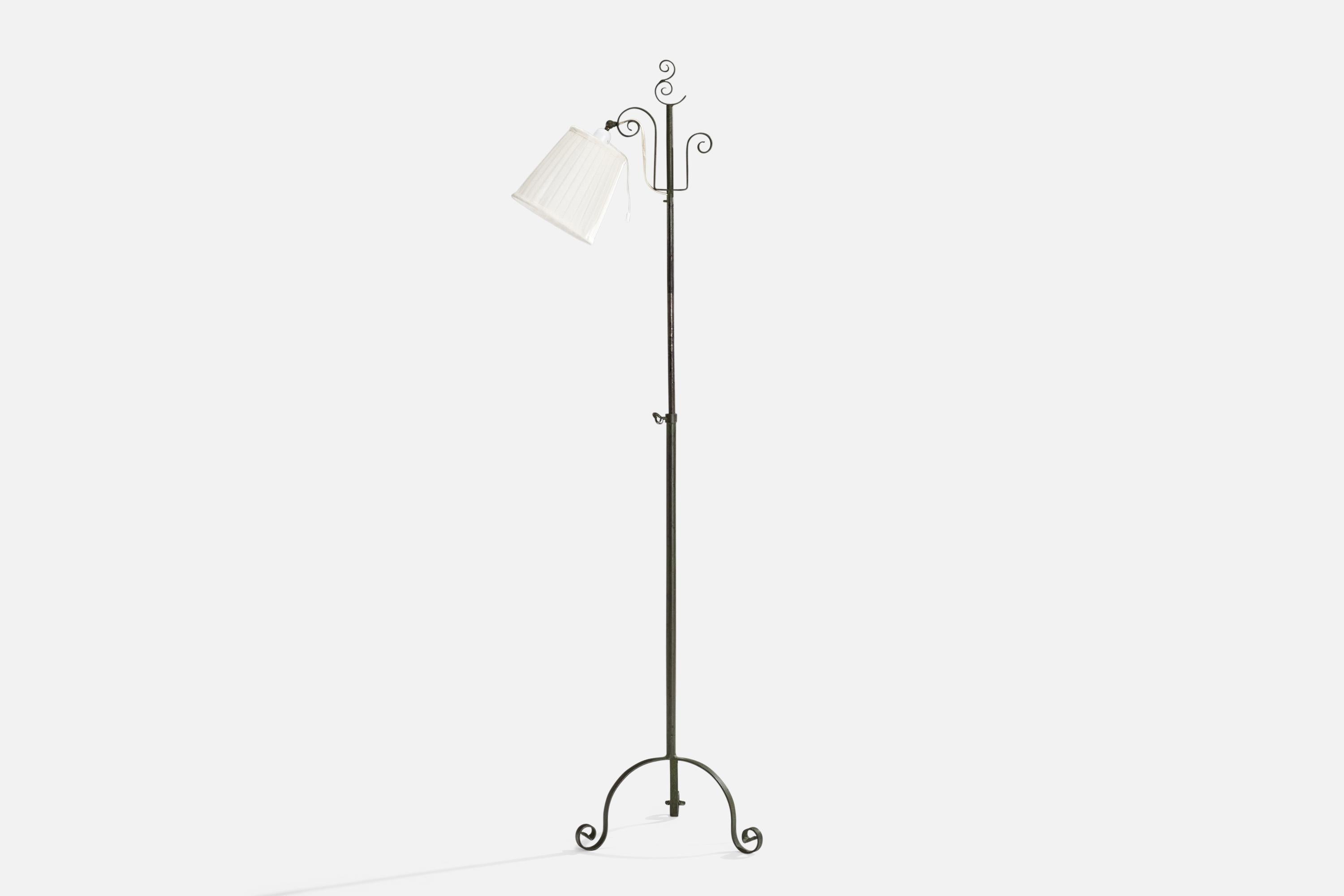 An adjustable wrought iron and beige fabric floor lamp, variation of model 15101, designed by Harald Notini and produced by Böhlmarks, Sweden, 1930s.

Dimensions variable 
Overall Dimensions (inches): 51.75” H x 7.75” W x 18” D
Stated dimensions