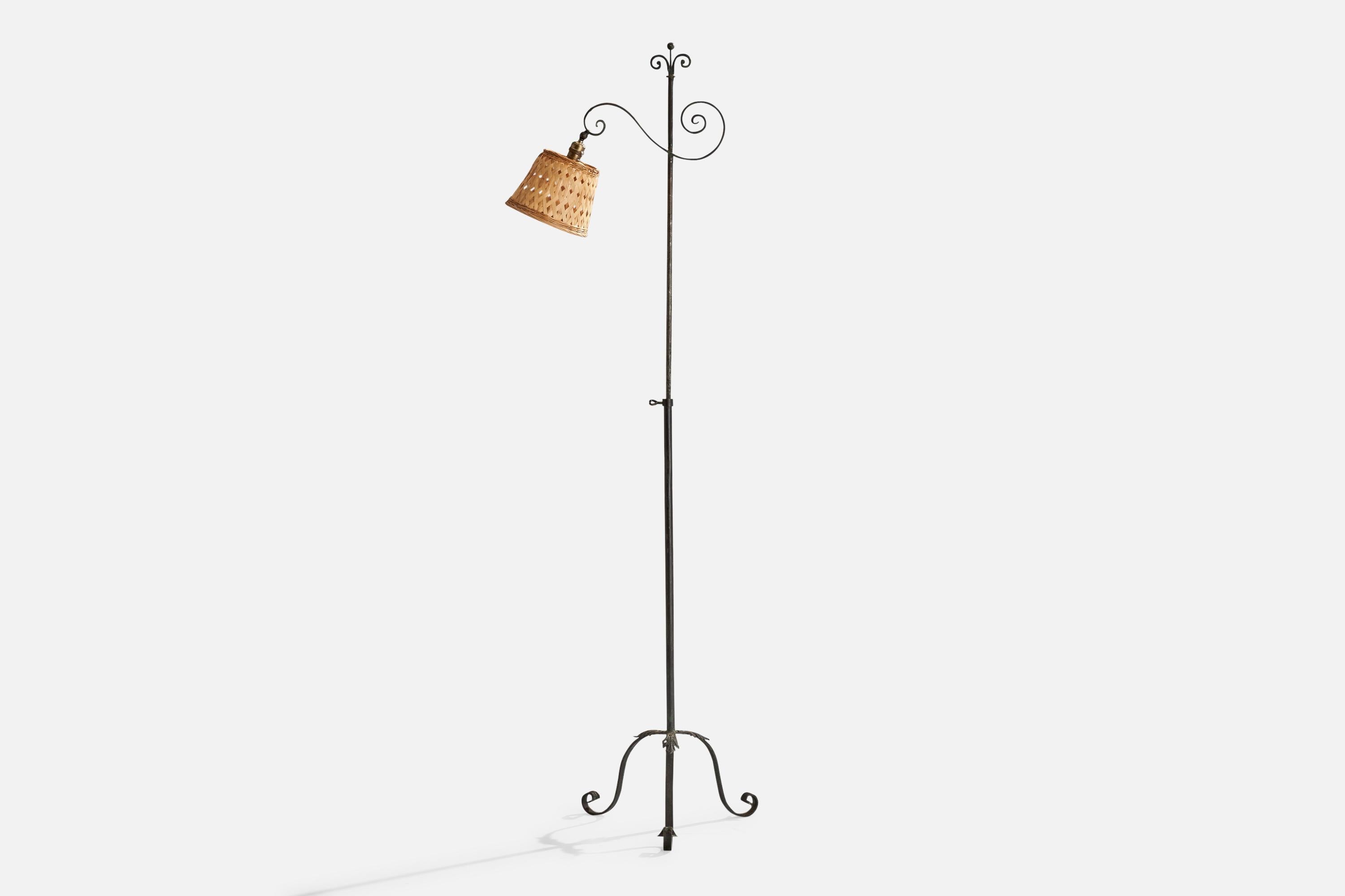 An adjustable wrought iron and beige fabric floor lamp, variation of model 15101, designed by Harald Notini and produced by Böhlmarks, Sweden, 1930s.

Dimensions variable 
Overall Dimensions (inches): 62.75” H x 7.25” W x 25.25” D
Stated dimensions