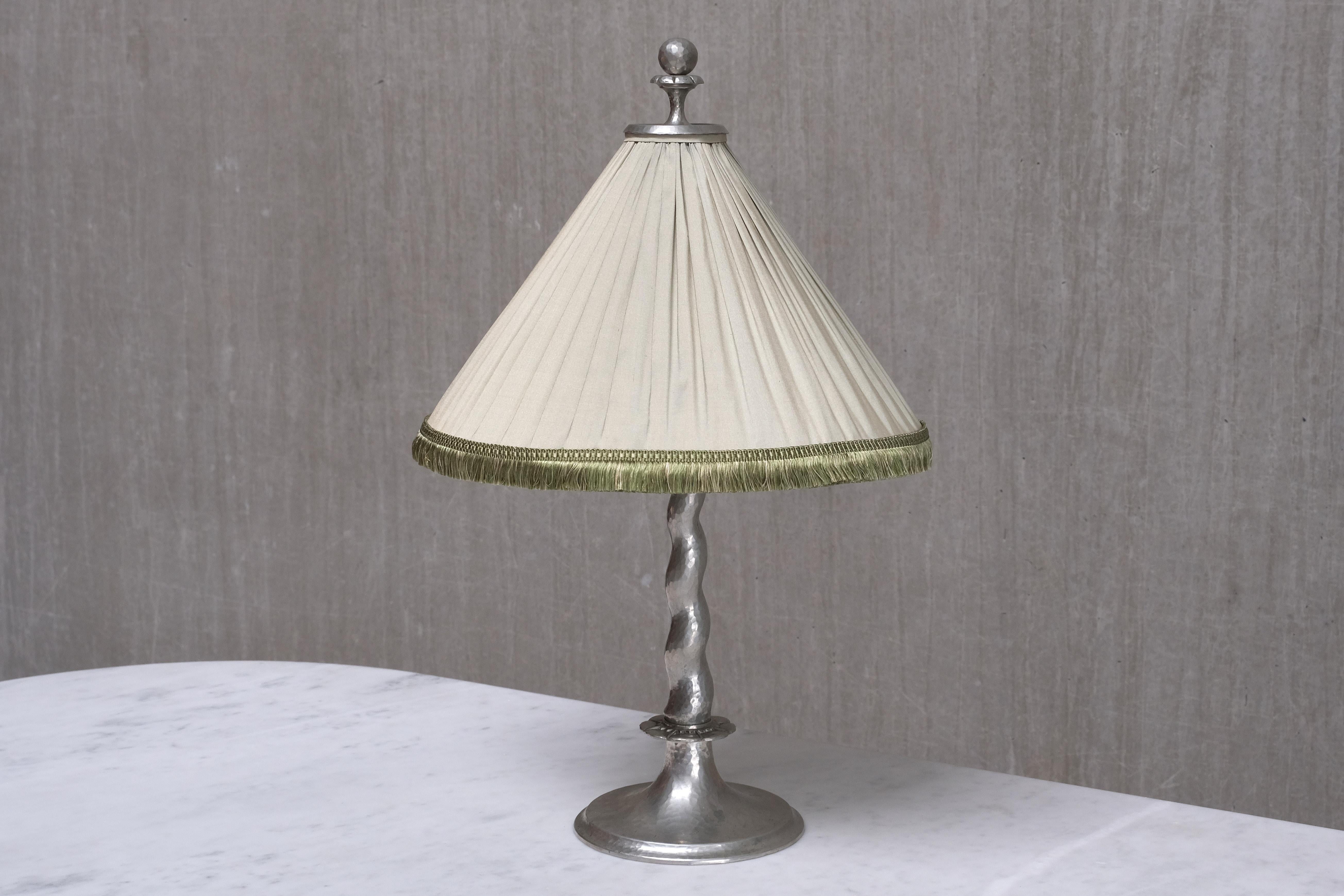 This exceptional table lamp was designed by Harald Notini in the mid 1920s and produced by Arvid Böhlmark's Lampfabrik in Sweden. This rare model, numbered '6891', is documented in Böhlmarks' 1926 catalogue.  The lamp is marked with the model number