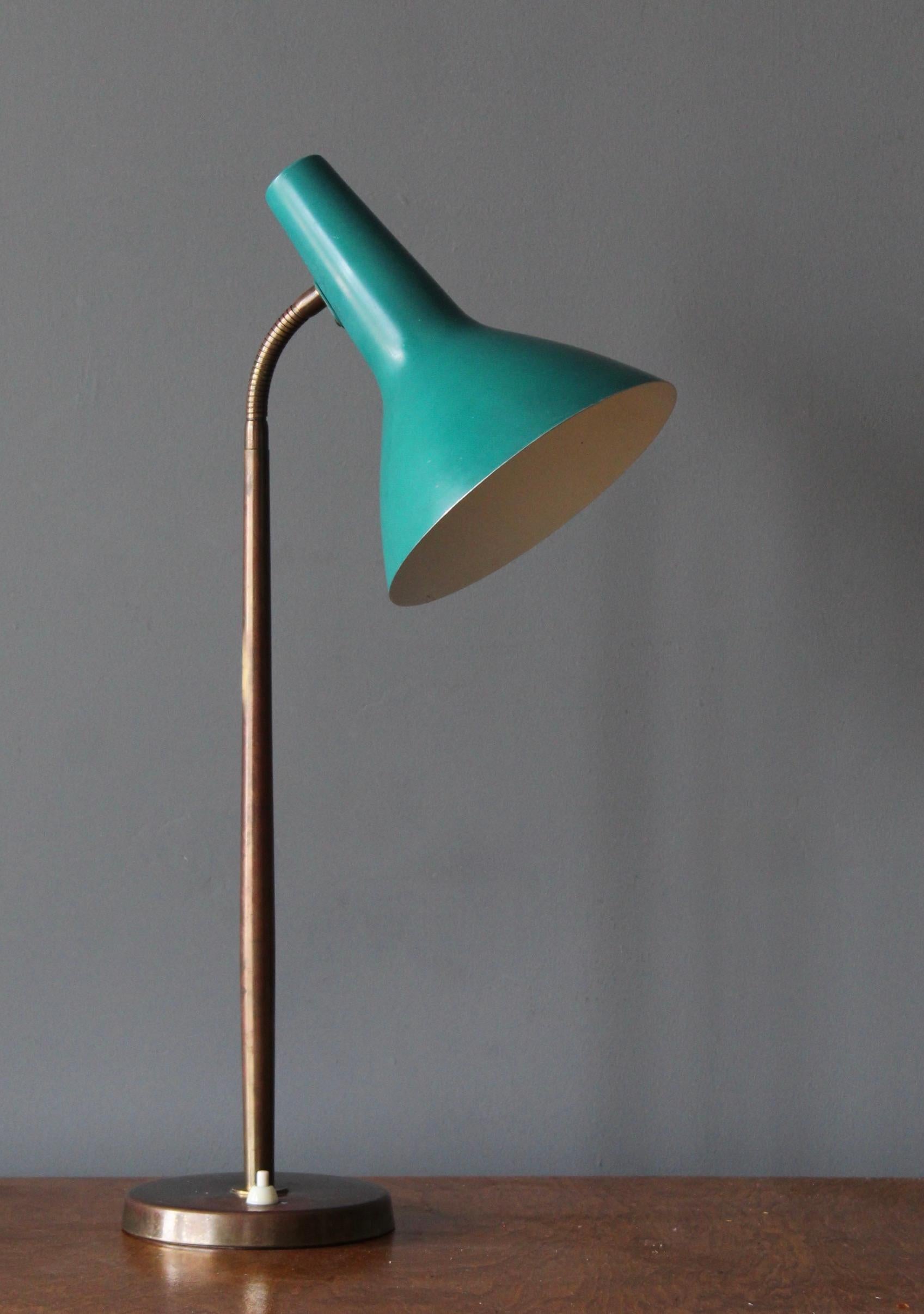 An adjustable table lamp. Designed by Harald Notini. Manufactured by Böhlmarks Lampfabrik, Sweden, 1940s. Brass and lacquered metal. Documented and stamped with makers mark and model number to underside.

Other designers of the period include