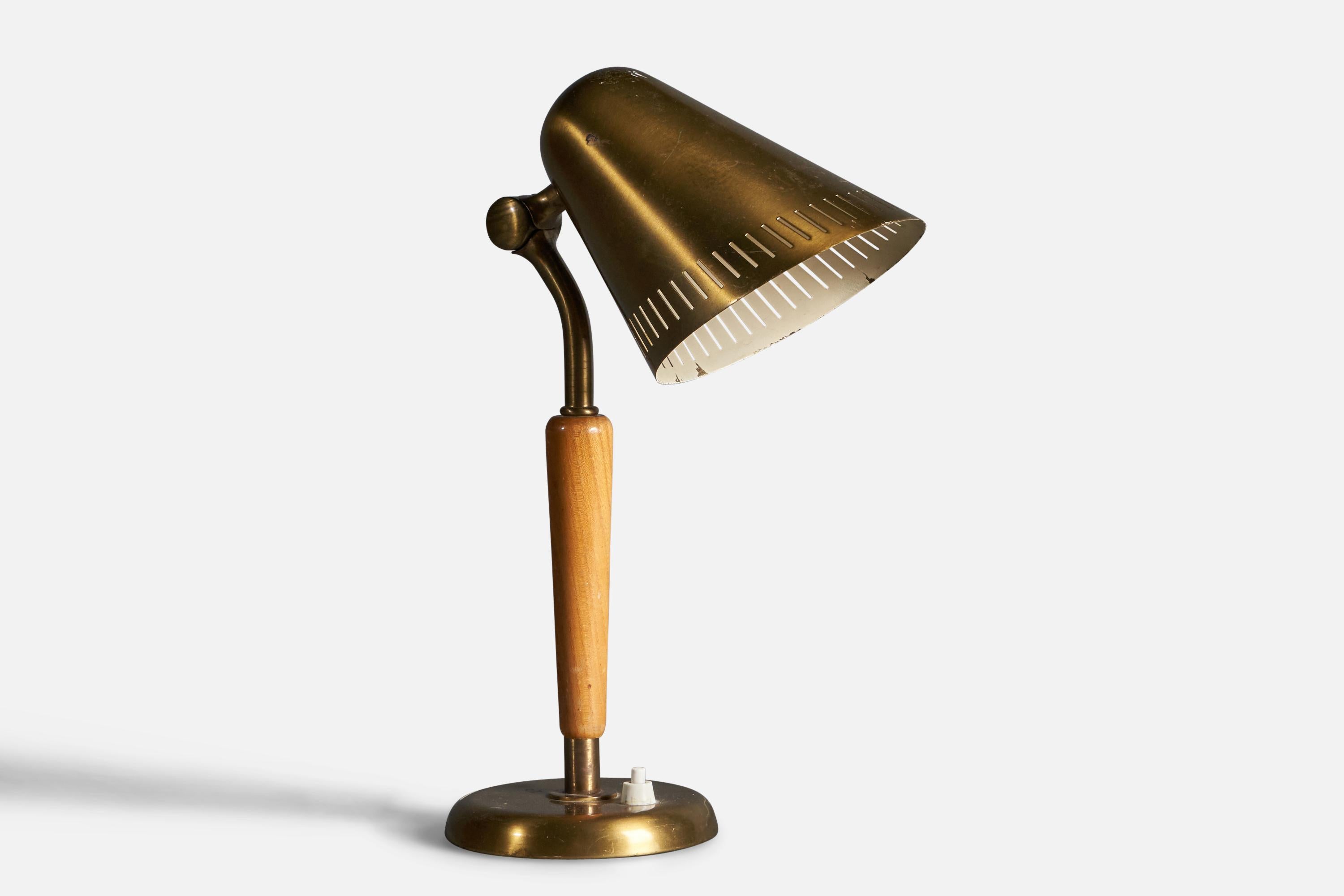 An adjustable modernist table lamp or desk light. Produced by the iconic Swedish lamp maker Böhlmarks, circa 1940. Design by Harald Notini.

Features a finely sculpted lacquered wood handle on a brass rod and base, brass screen.

Other designers