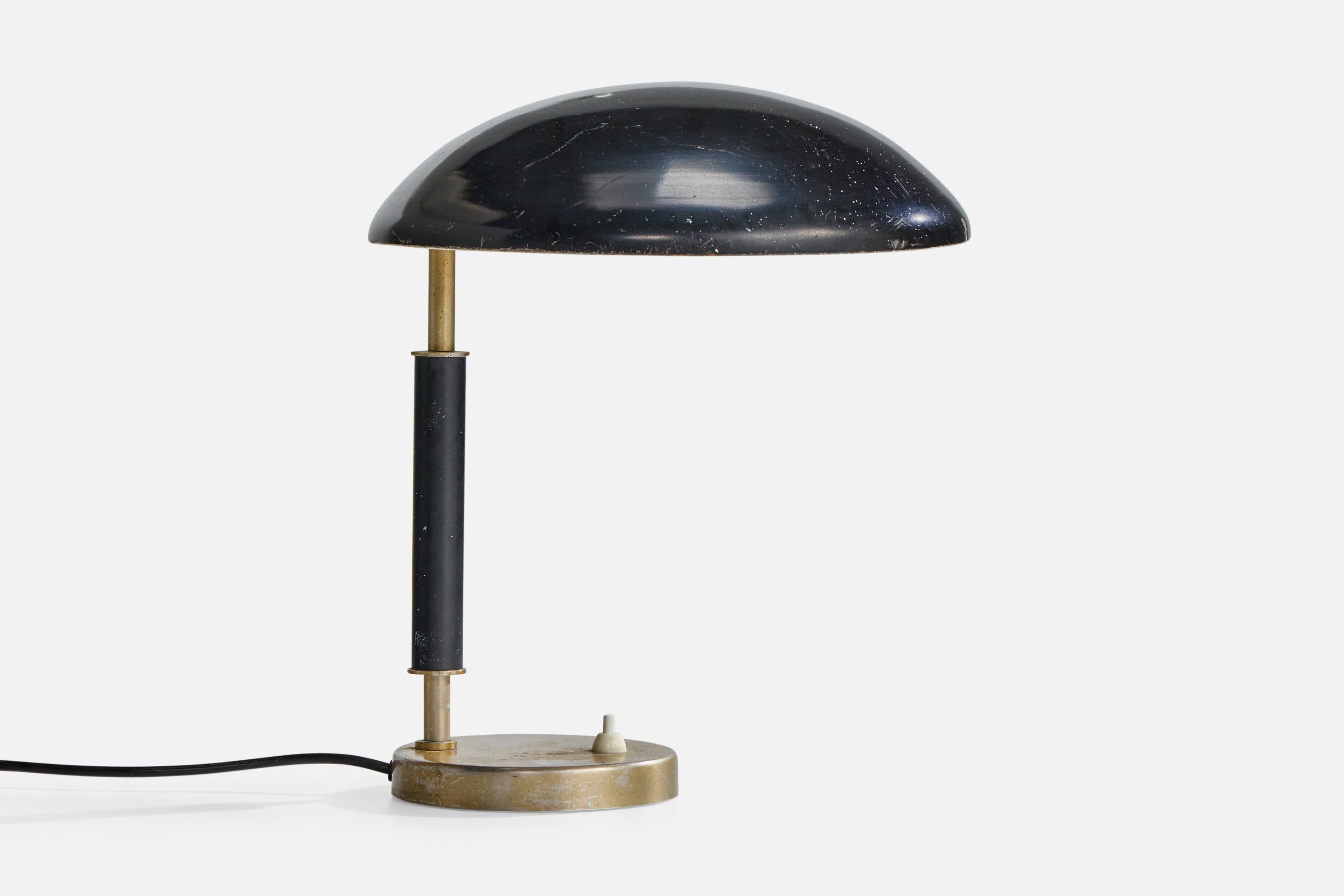 A nickel-plated and black-lacquered metal table lamp, model 6994, designed by Harald Notini and produced by Arvid Böhlmarks Lampfabrik, Sweden, c. 1930s.

Dimensions of Lamp (inches): 13.25
