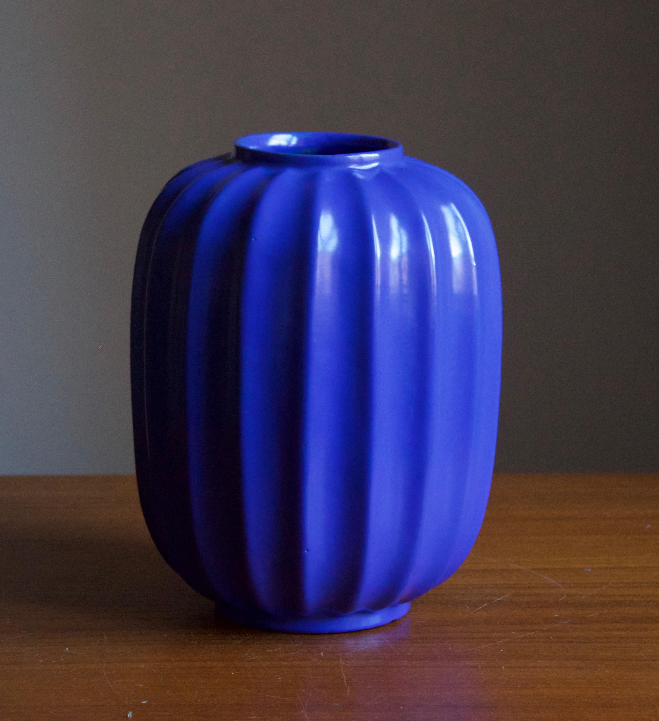 An early modernist vase. Production attributed to Upsala-Ekeby, Sweden, c. 1940s. Blue Glazed earthenware. Design attributred to Harald Östergren (1888-1974). Unmarked.

Other designers of the period include Ettore Sottsass, Carl Harry Stålhane,