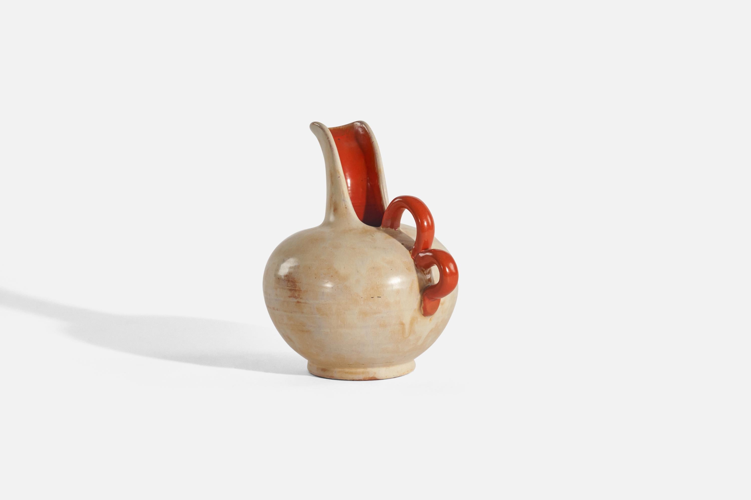 A beige and red, glazed earthenware vase designed by Harald Östergren and produced by Upsala-Ekeby, Sweden, c. 1930s. 
