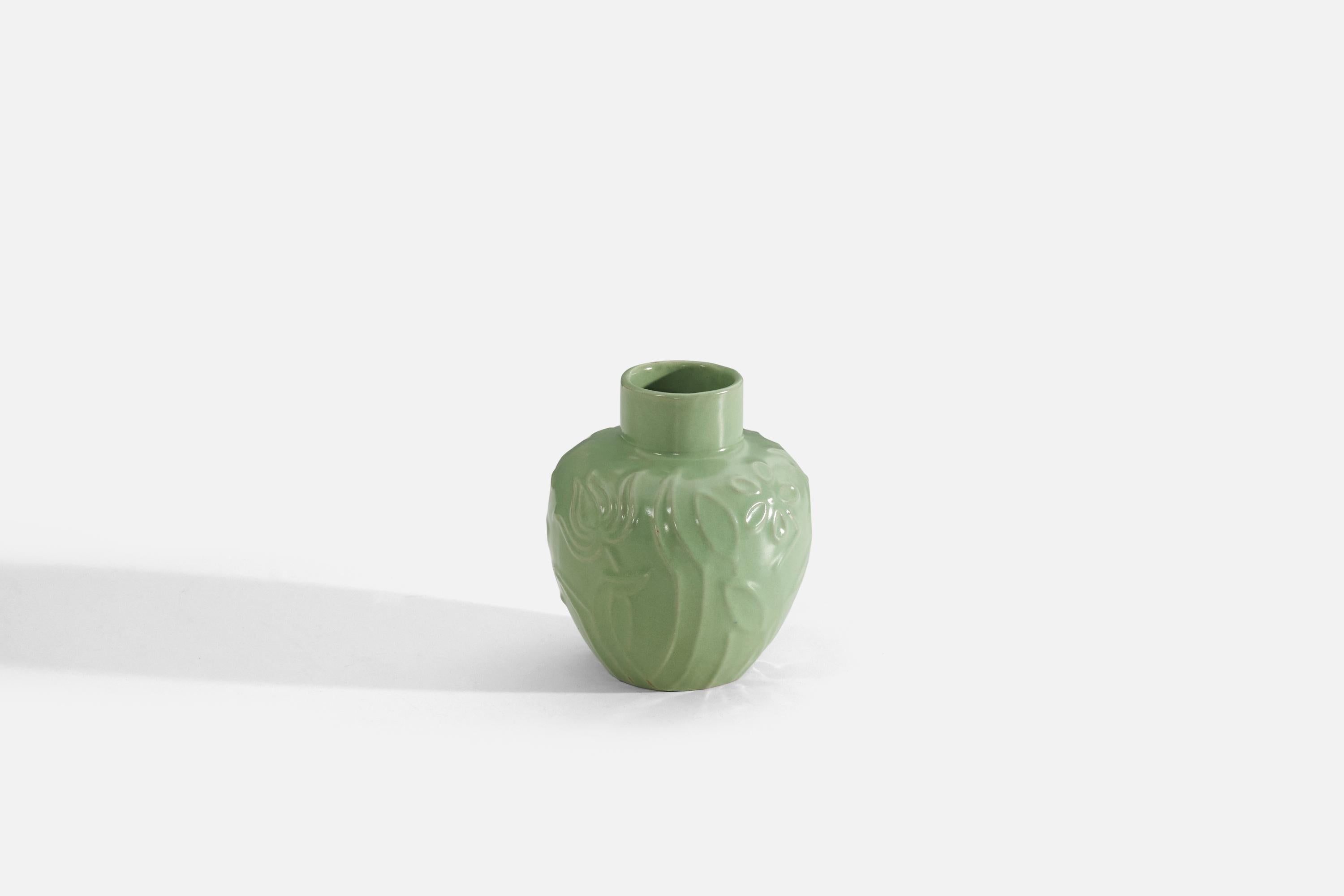 A green-glazed earthenware vase with floral motif produced by Upsala-Ekeby, Sweden, c. 1930s-1940s. Designed by Harald Östergren (1888-1974).

