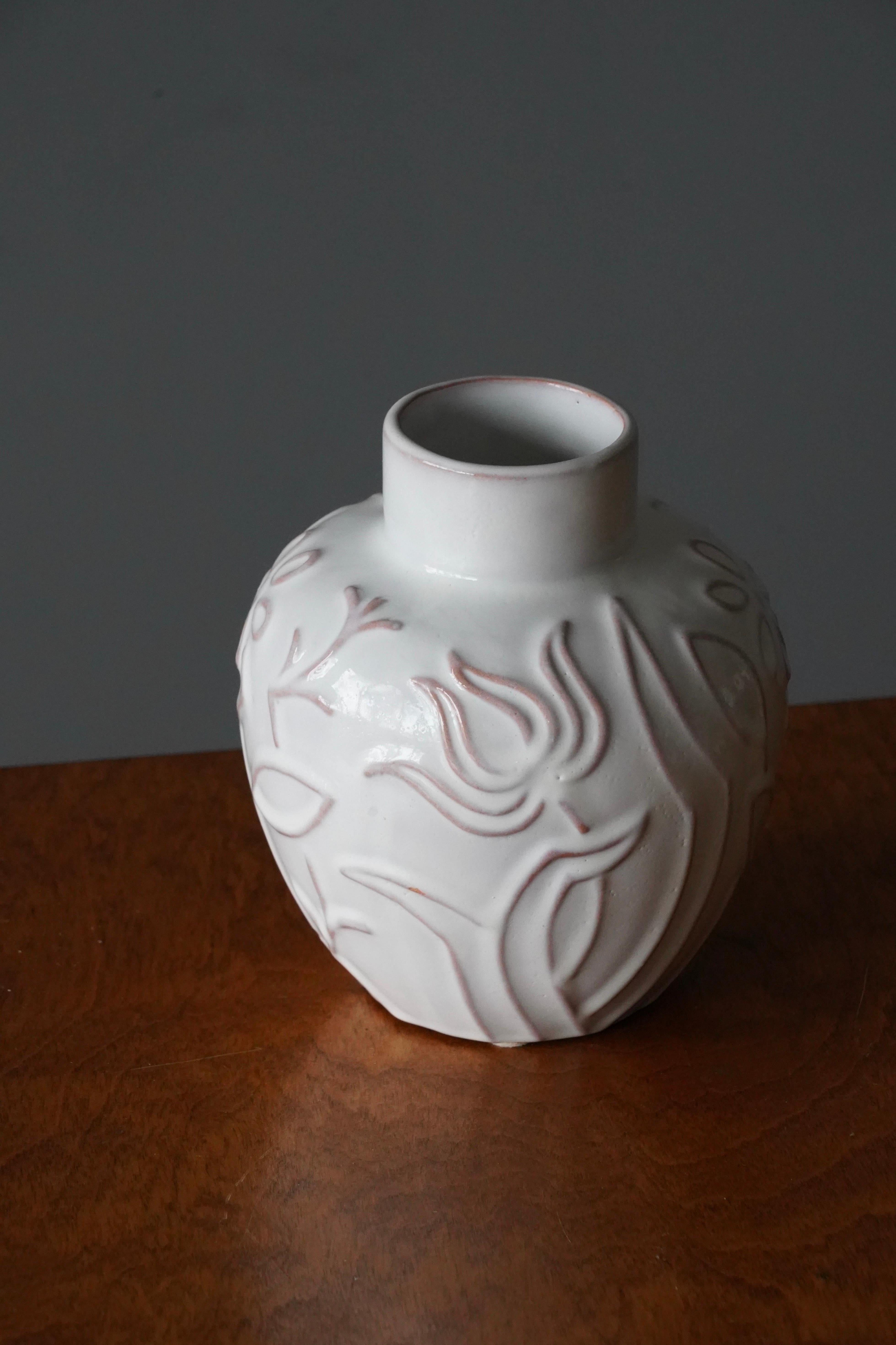 An early modernist vase. Produced by Upsala-Ekeby, Sweden, 1940s. Designed by Harald Östergren (1888-1974). Features white cream glaze. Earthenware.

Other designers of the period include Ettore Sottsass, Carl Harry Stålhane, Lisa Larsson, Axel