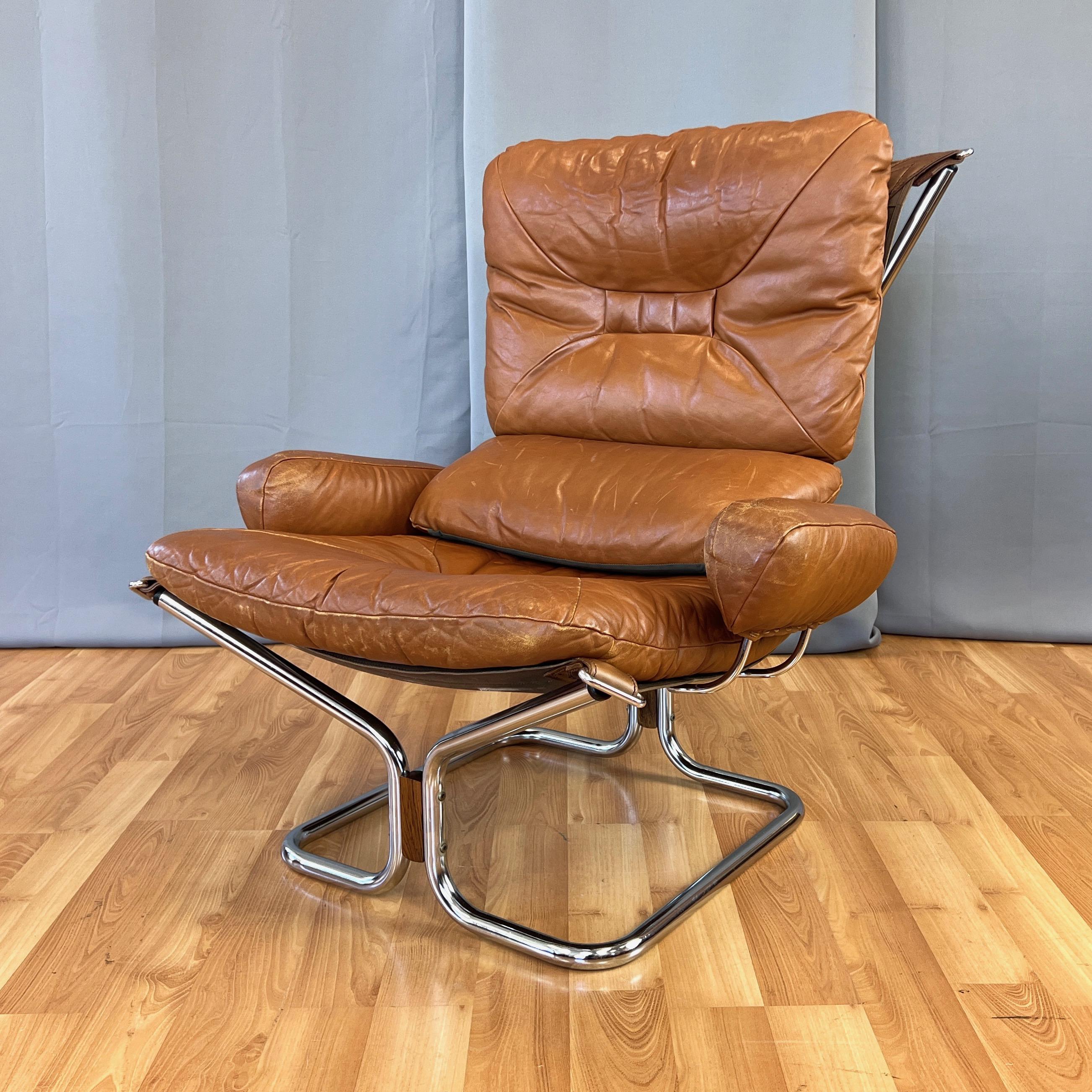 A strikingly handsome—and rather scarce Stateside—1970s Scandinavian modern leather, chrome, and rosewood high back Wing lounge chair designed by Harald Relling, and manufactured by P.I. Langlos Fabrikker for Westnofa of Norway.

Incredibly