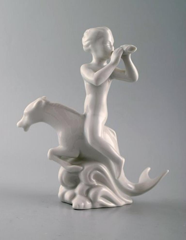 Harald Salomon for Rörstrand, Blanc de Chine / white glazed figure of a fawn riding on fable creature.
Stamped. Sweden, mid-20 century.
In perfect condition. 1st. Assortment.
Measures: 16 x 17 cm.