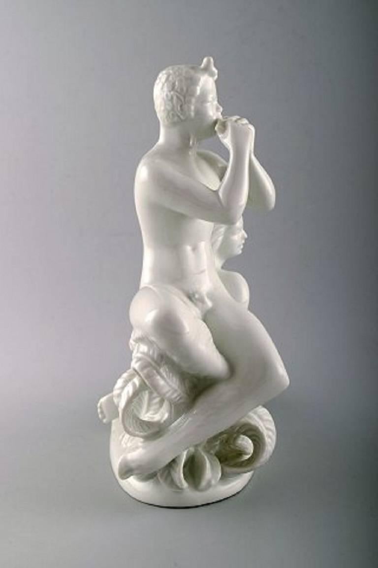 Harald Salomon for Rörstrand, white glazed porcelain Art Deco figure of a naked woman and flute-playing pan, 1940s.
Marked.
In perfect condition.
Measures: 25 cm. x 25 cm.