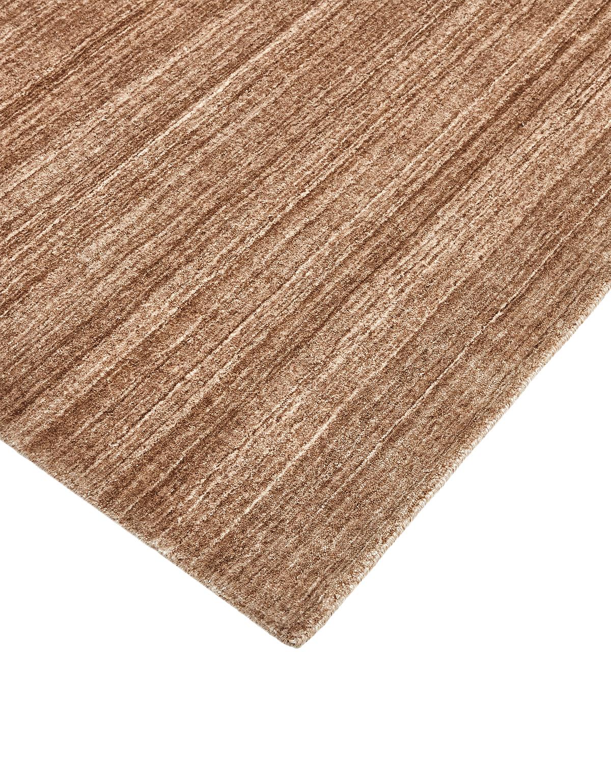 Color: Caramel, made in India. 70% wool, 30% viscose. Subtle tone-on-tone stripes give the Solid collection a depth and sophistication all its own. These rugs can pull the disparate elements of a room into a beautifully cohesive whole; they can also