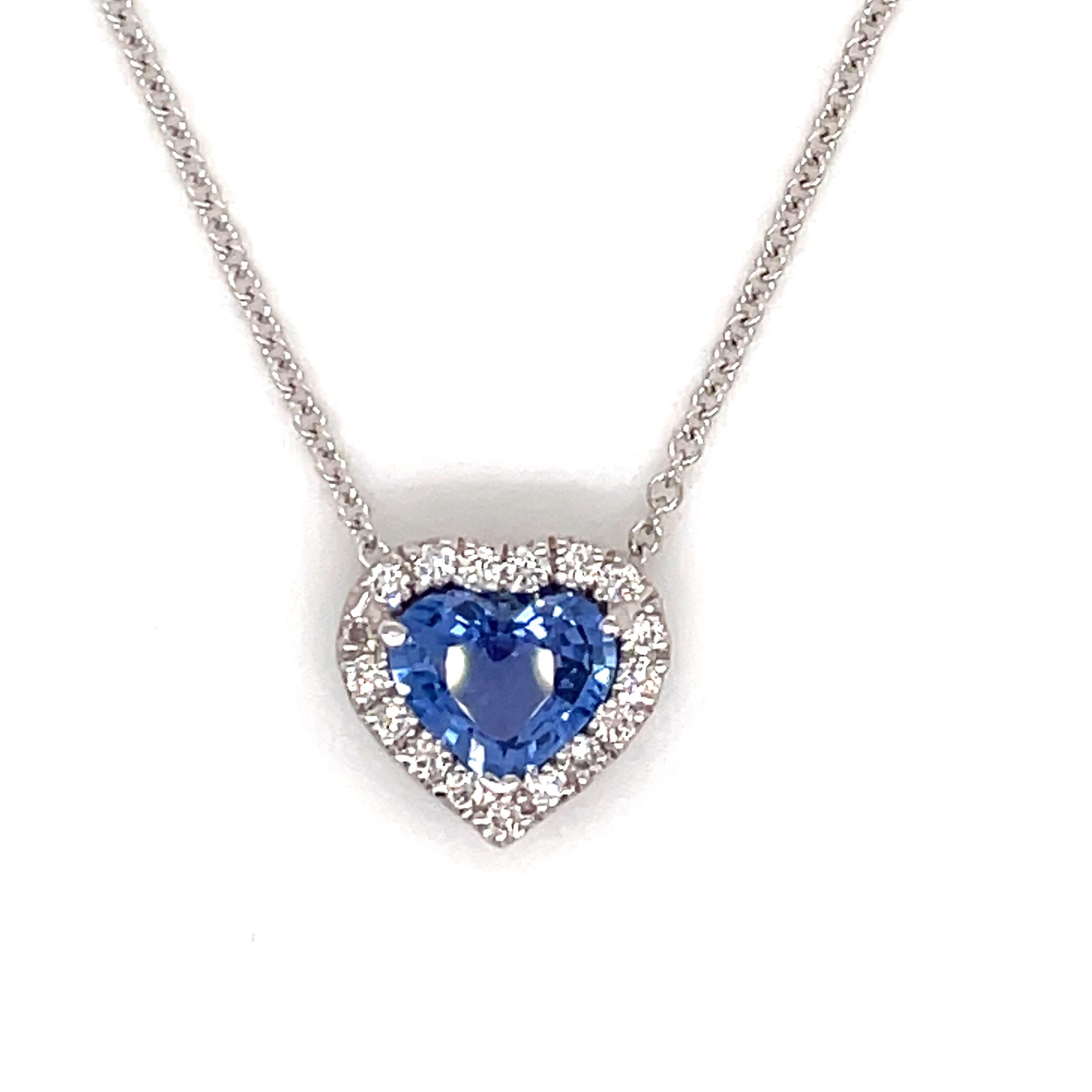 One blue heart shape Sapphire weighing 1.32 carats flanked with a diamond halo weighing 0.23 carats, in 18k white gold.
Color G-H
Clarity SI