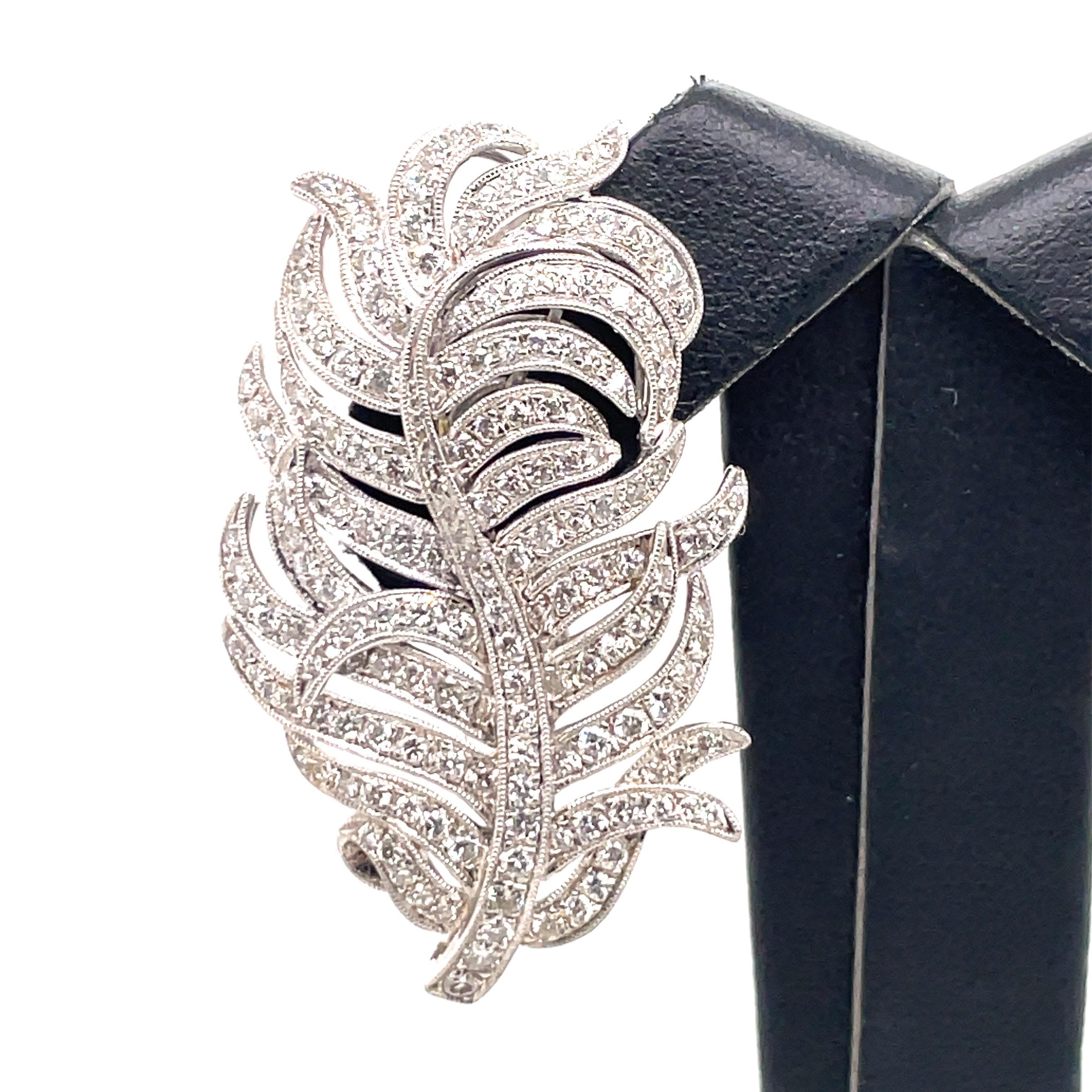 18K White gold floral leaf earrings featuring numerous round brilliants weighing 4 carats. 
Color G-H
Clarity SI