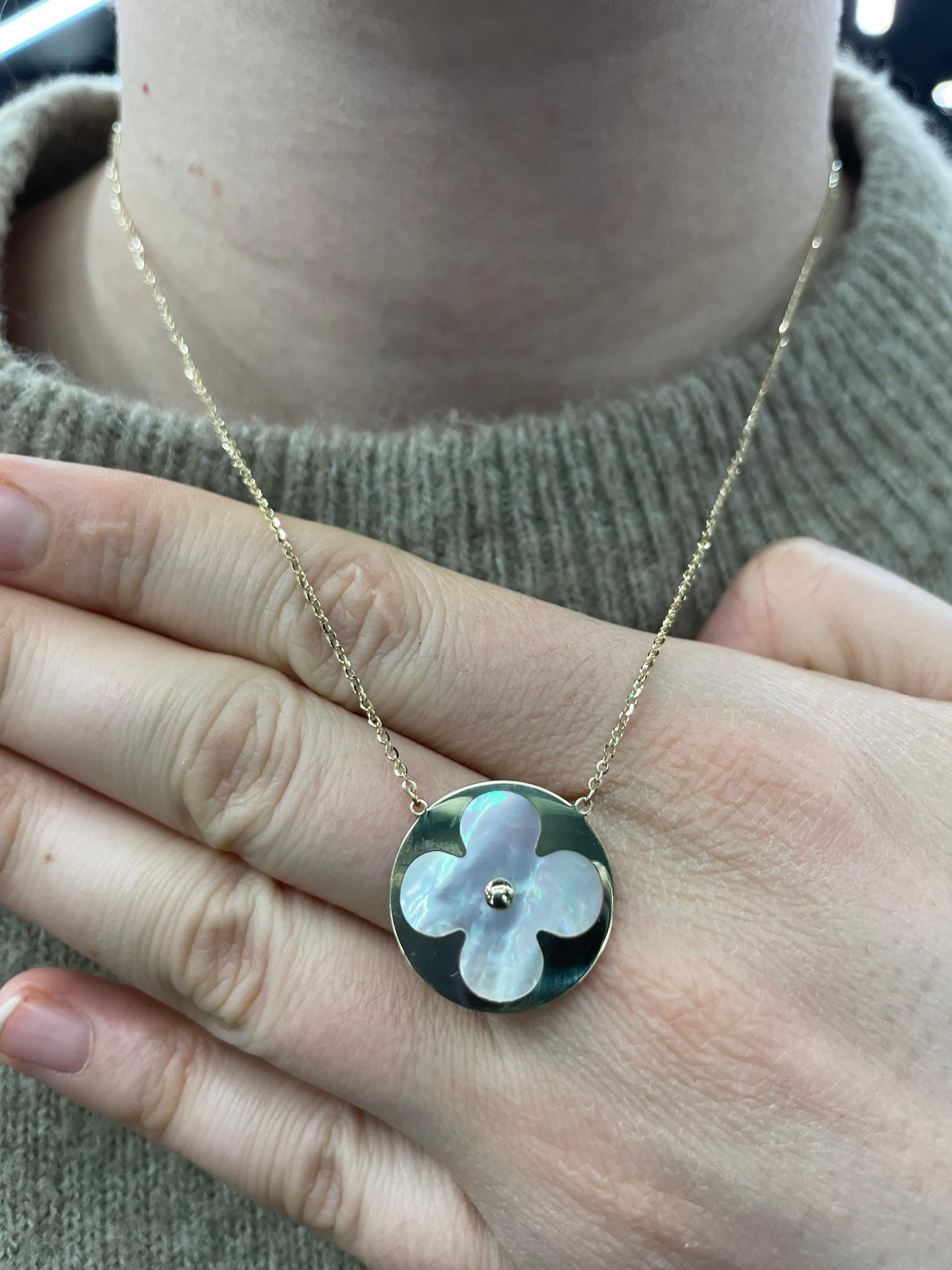 Italian 14K Yellow gold pendant featuring a Mother of Pearl clover on a 16 inch cable chain. Adjustable to 14 inches. More styles available. 