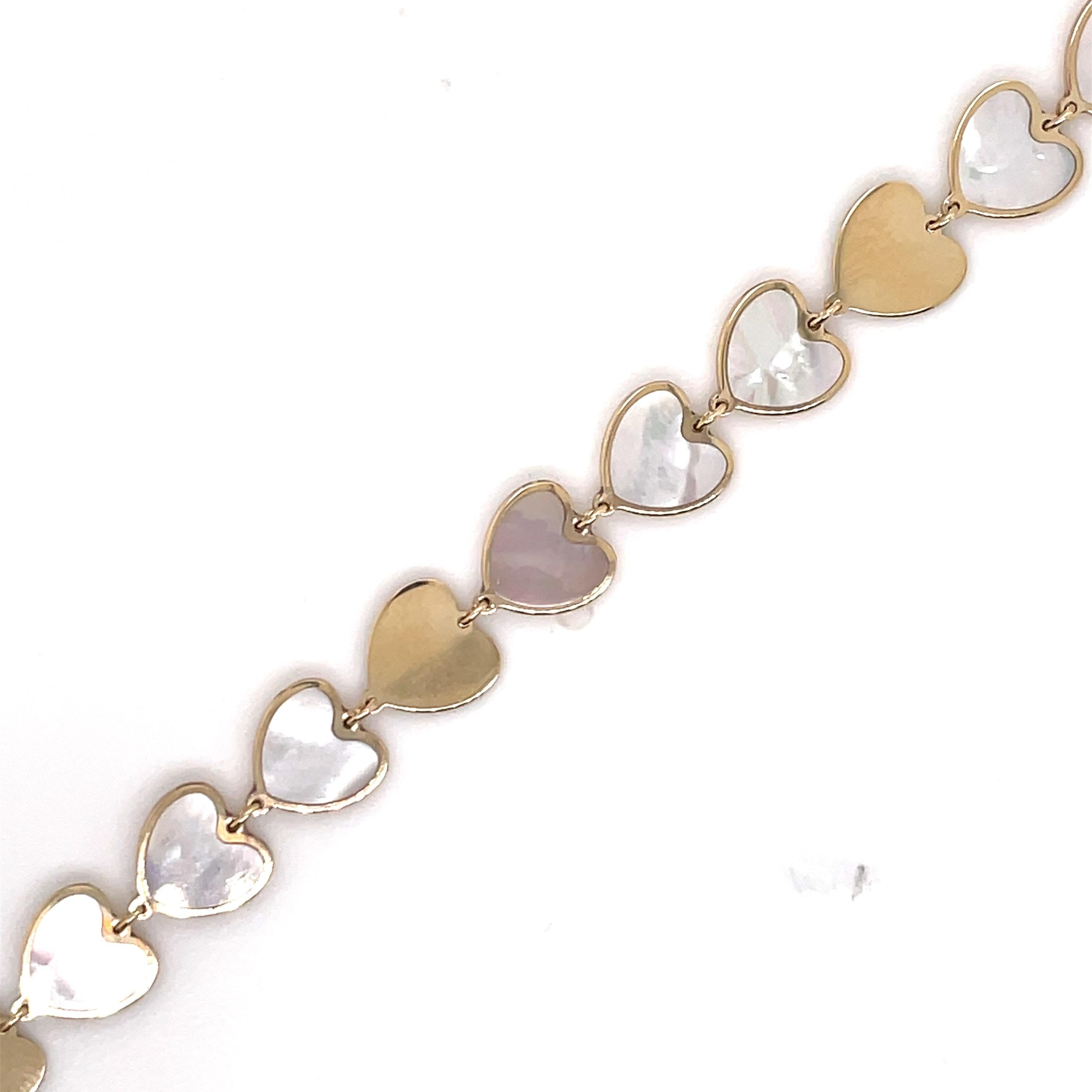 Italian 14k yellow gold heart mother of pearl and solid gold bracelet. 
Super fun and trendy! 
Available in different colors and styles. 